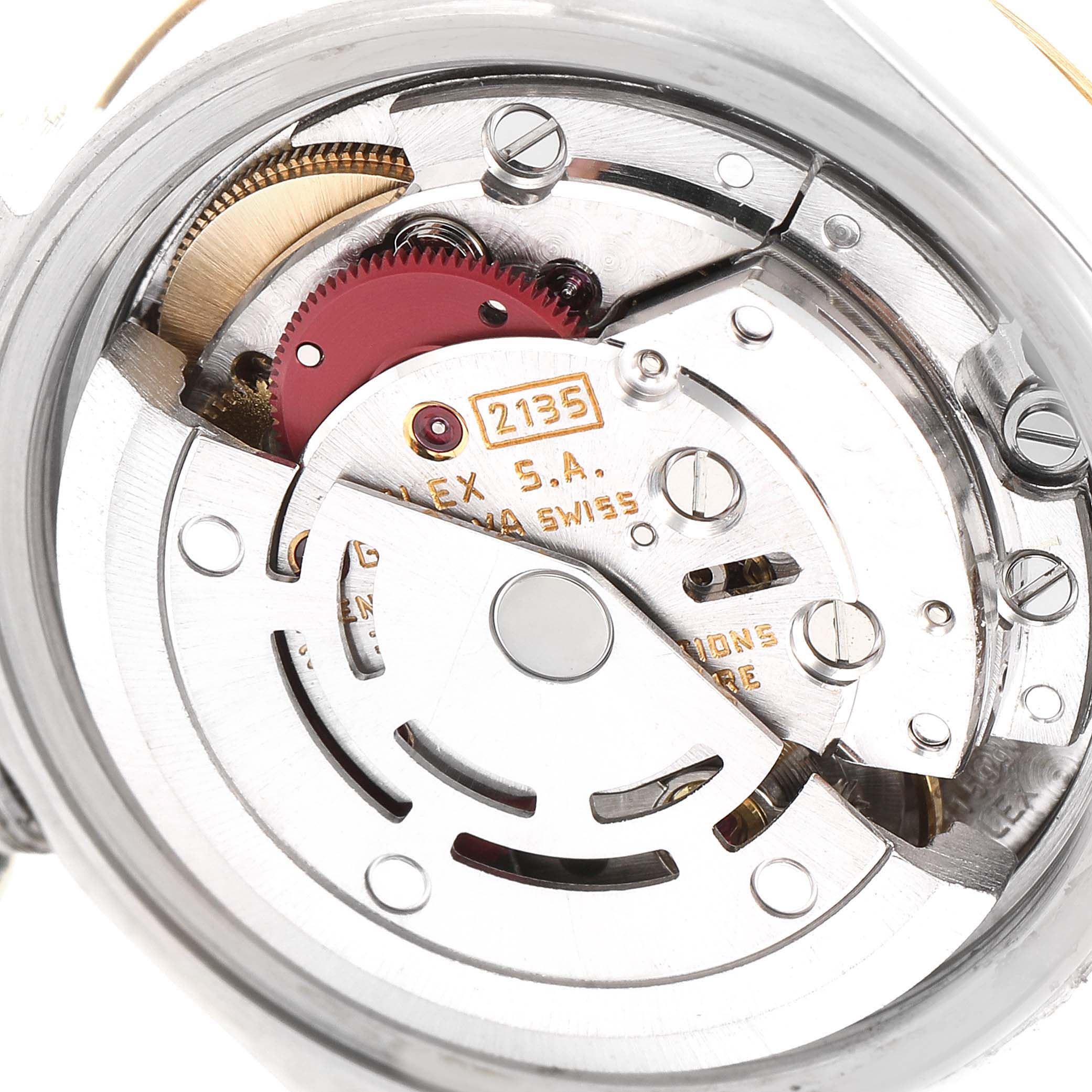 This image shows the inner mechanical movement of a Rolex Datejust 69173 Women's Steel and Gold (two tone) Champagne Dial 69173 Women's Steel and Gold (two tone) Champagne Dial watch, focusing on the rotor and intricate gears.