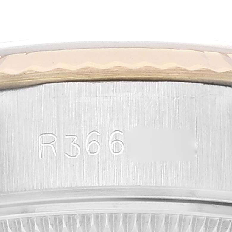 The image shows a close-up view of the serial number engraving on the side of a Rolex Datejust 69173 Women's Steel and Gold (two tone) Champagne Dial 69173 Women's Steel and Gold (two tone) Champagne Dial watch case.