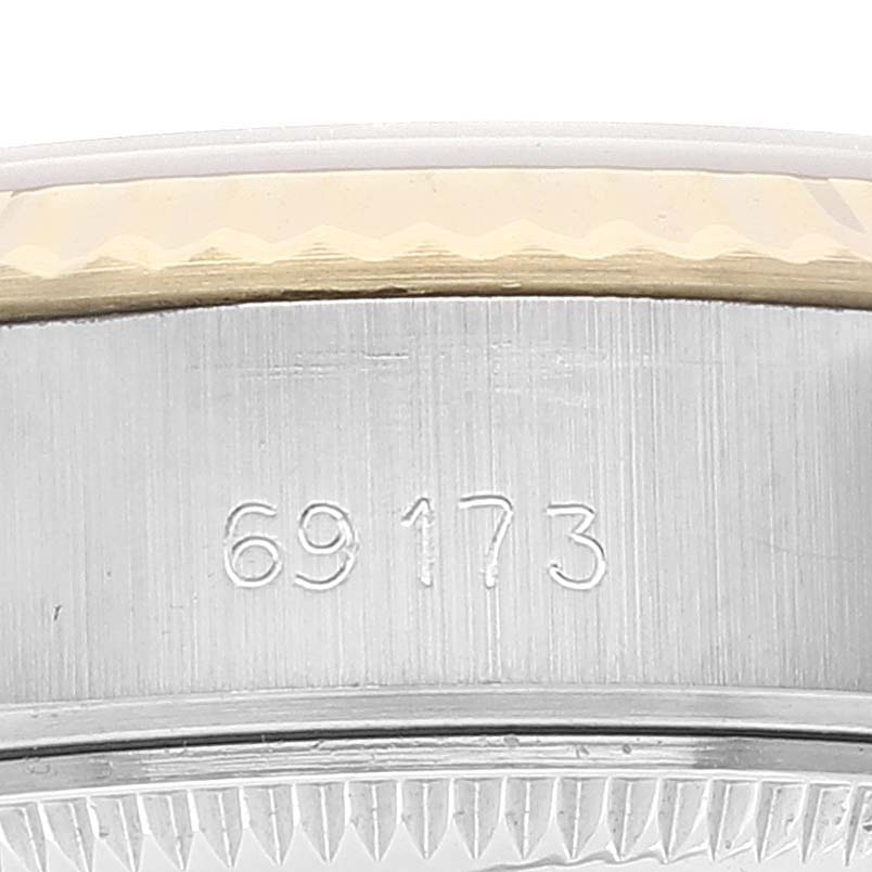 This close-up image of a Rolex Datejust 69173 Women's Steel and Gold (two tone) Champagne Dial 69173 Women's Steel and Gold (two tone) Champagne Dial watch shows the engraved model number "69173" on the case.