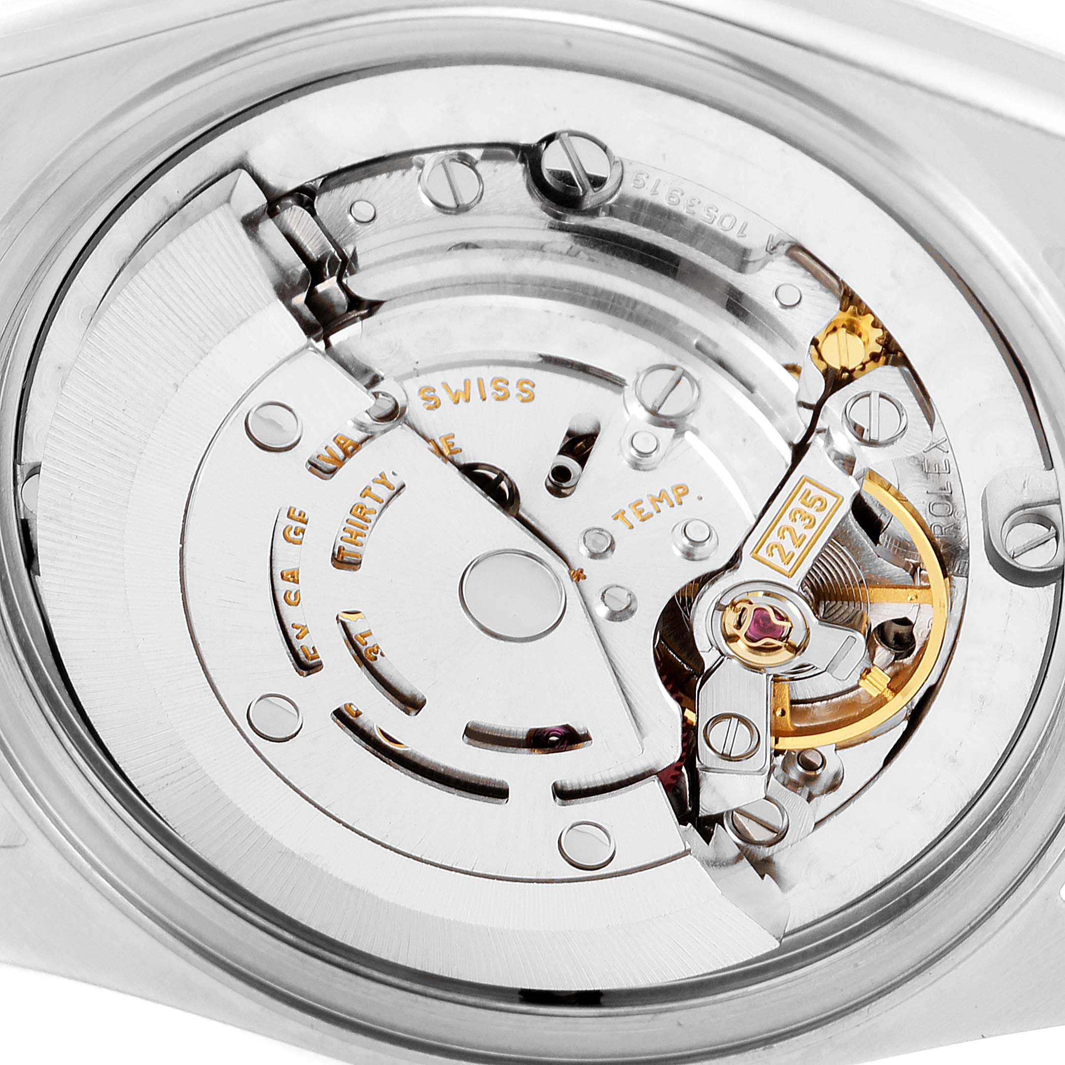 This close-up image shows the movement mechanism of a Rolex Mid-Size 78243 Women's Steel and Gold (two tone) Grey Dial 78243 Women's Steel and Gold (two tone) Grey Dial model watch from the back.