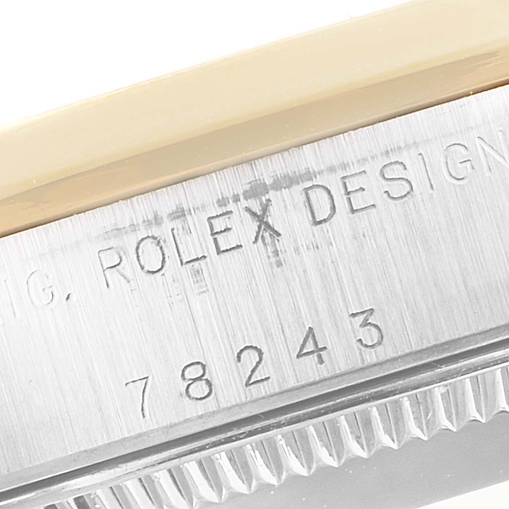 The image shows a close-up angle of the casing with the model number of a Mid-Size Rolex watch: 78243.