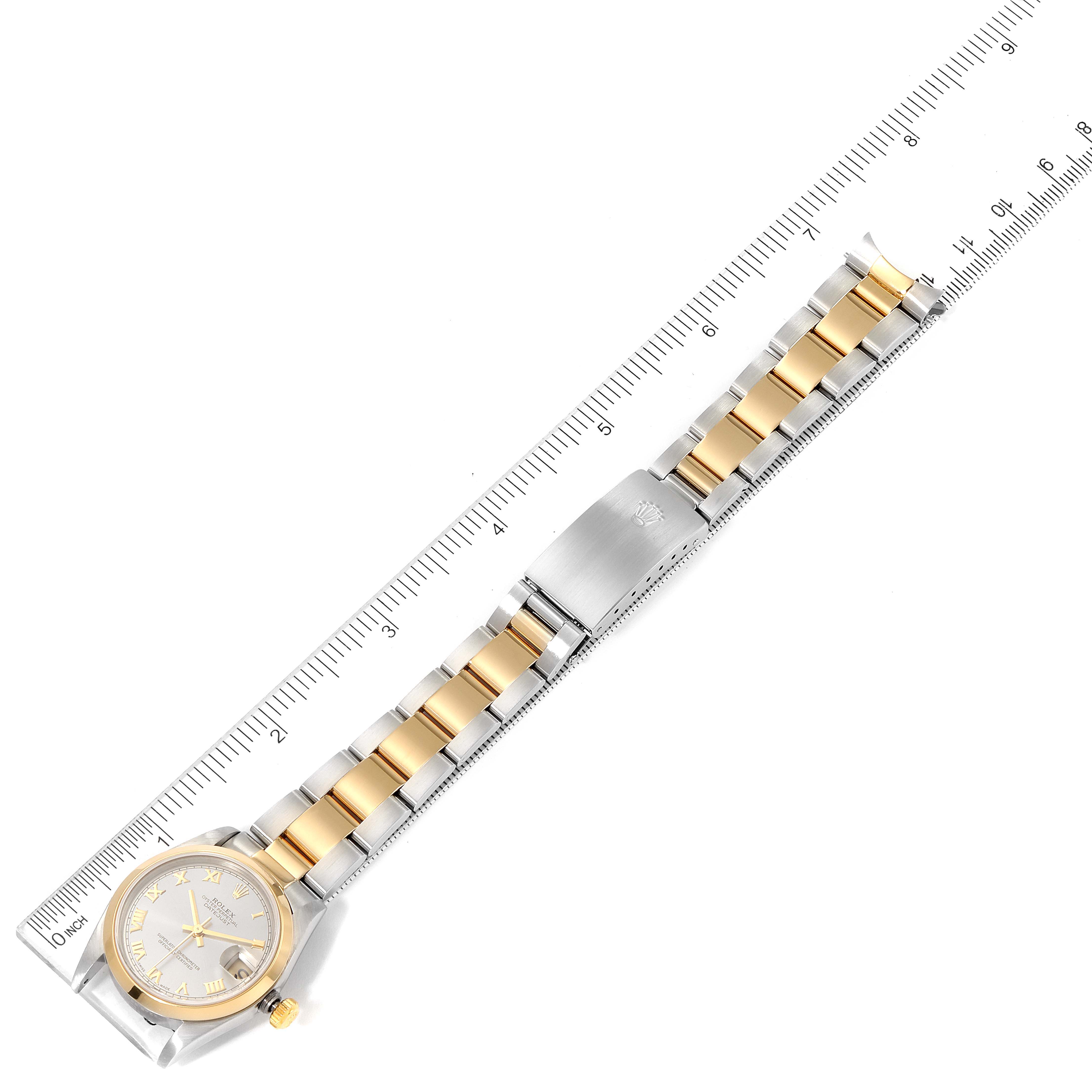 The image shows a Rolex Mid-Size 78243 Women's Steel and Gold (two tone) Grey Dial 78243 Women's Steel and Gold (two tone) Grey Dial watch laid flat, with the band and clasp fully visible alongside a ruler for size reference.