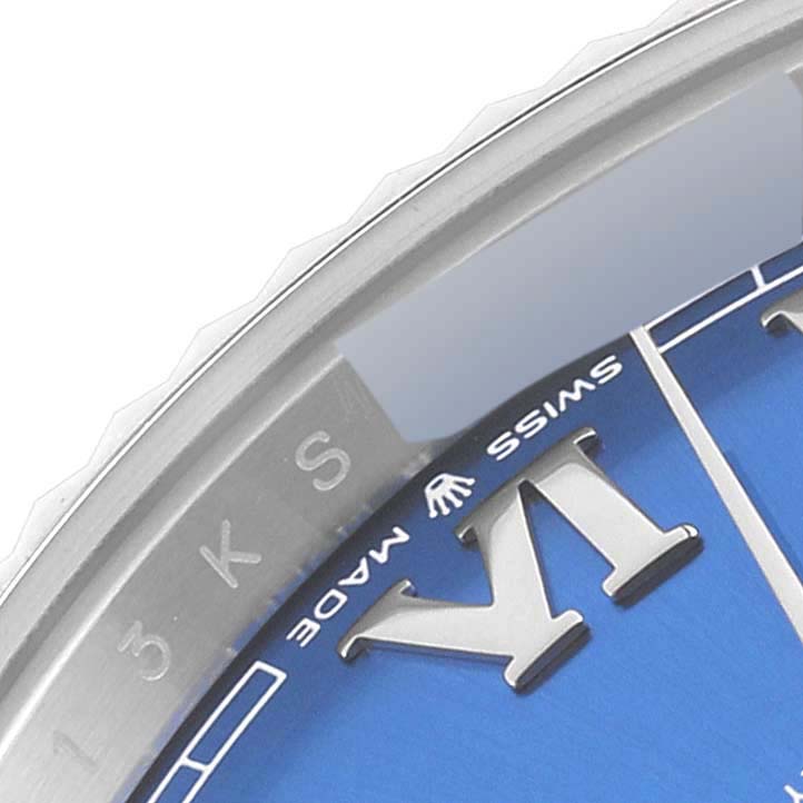 The image shows a close-up of the Rolex Datejust 41 126334 Men's Stainless Steel Blue Dial's edge, highlighting the bezel and part of the blue dial with Roman numeral markers.