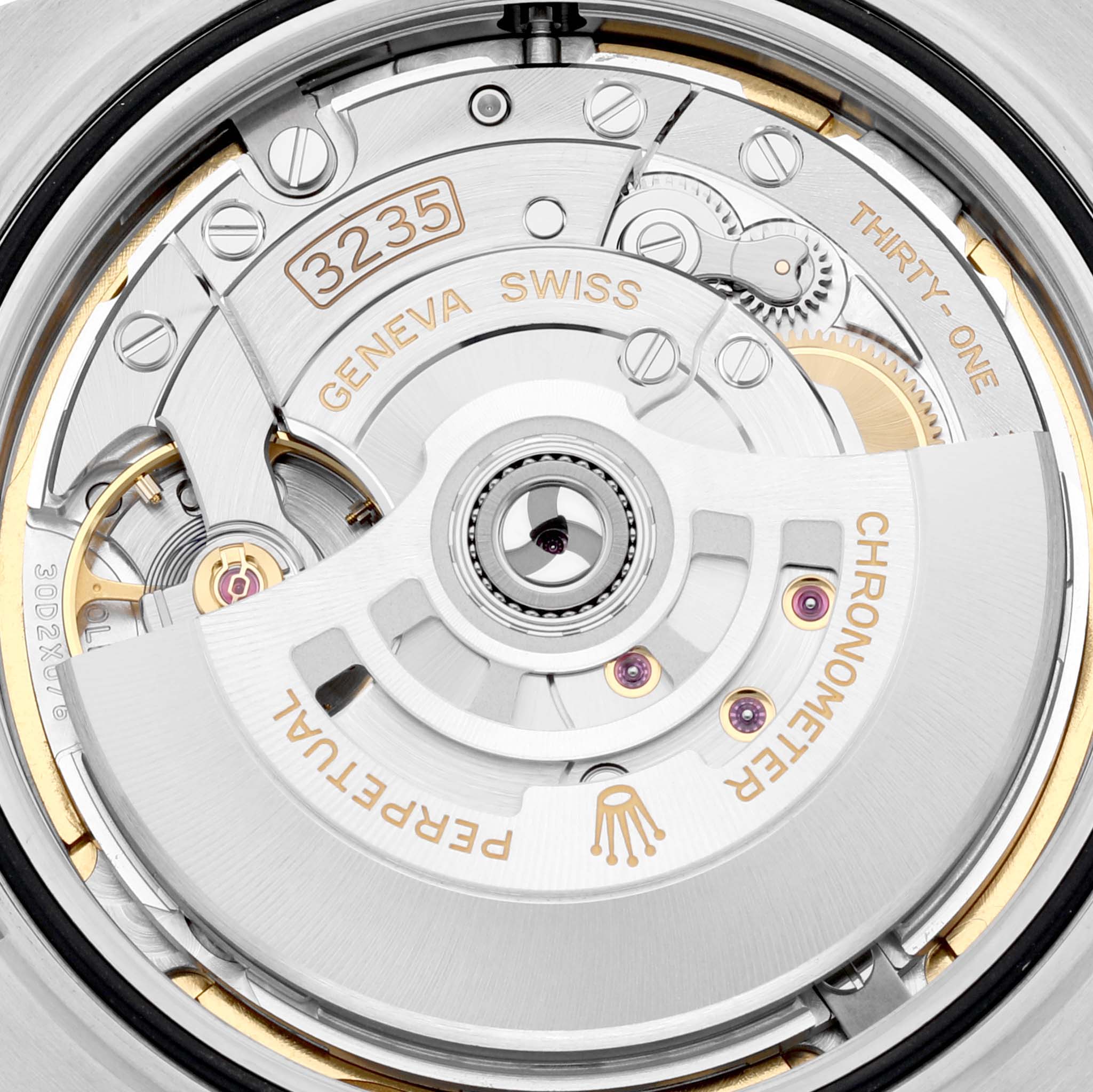 This image shows the movement mechanism of the Rolex Datejust 41 126334 Men's Stainless Steel Blue Dial, highlighting its intricate gears and engravings.