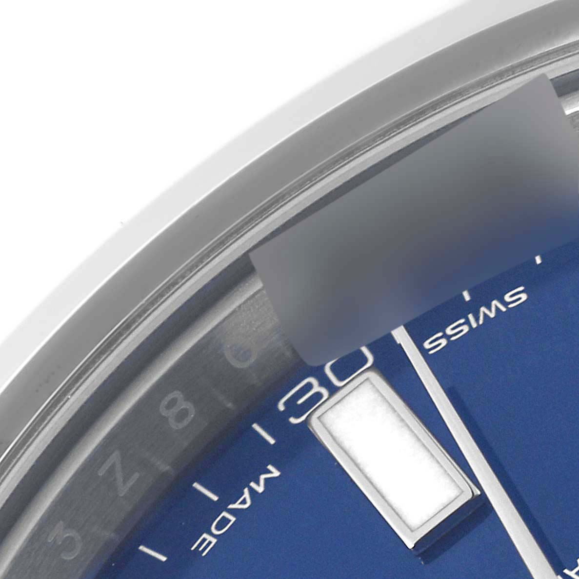 The image shows a close-up of the dial, bezel, and part of the "Date" display of a Rolex Datejust 116300 Men's Stainless Steel Blue Dial 116300 Men's Stainless Steel Blue Dial watch.