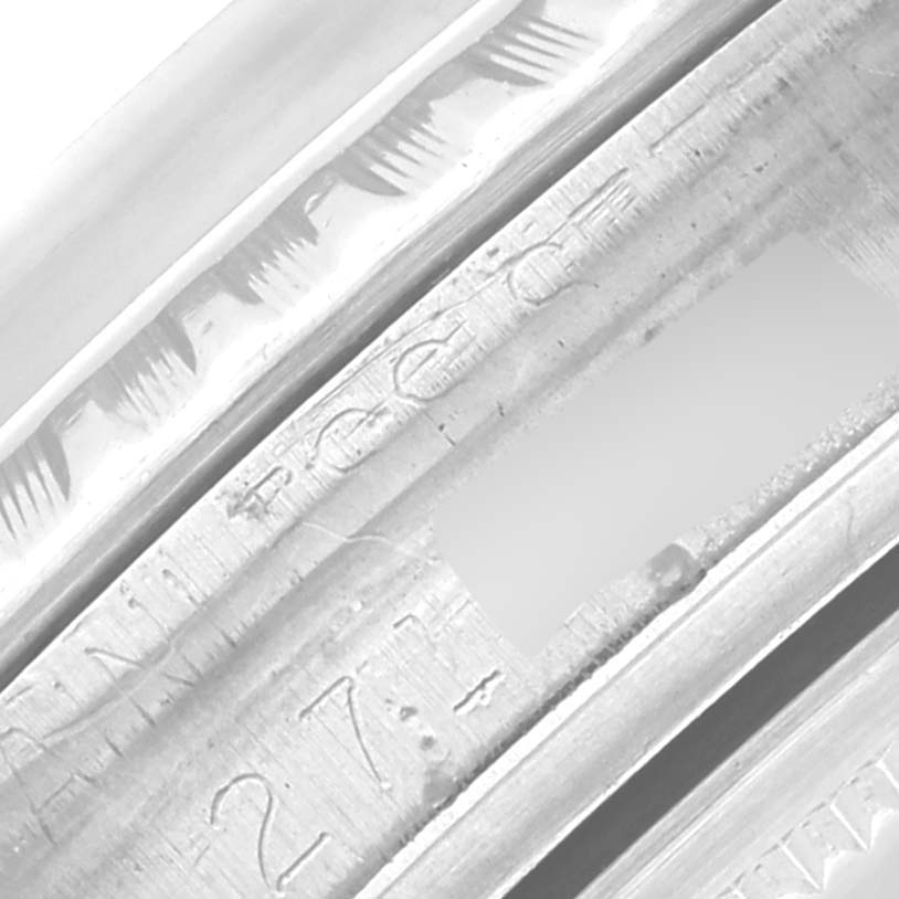 Close-up of the engraving on the inner case of a Rolex Vintage Collection 1603 Men
s Stainless Steel Silver Dial 1603 Men
s Stainless Steel Silver Dial watch, showing serial numbers.
