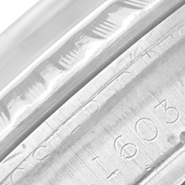 This close-up image of the Rolex Vintage Collection 1603 Men
s Stainless Steel Silver Dial 1603 Men
s Stainless Steel Silver Dial model focuses on the watch
s case, showing partial serial number engravings.