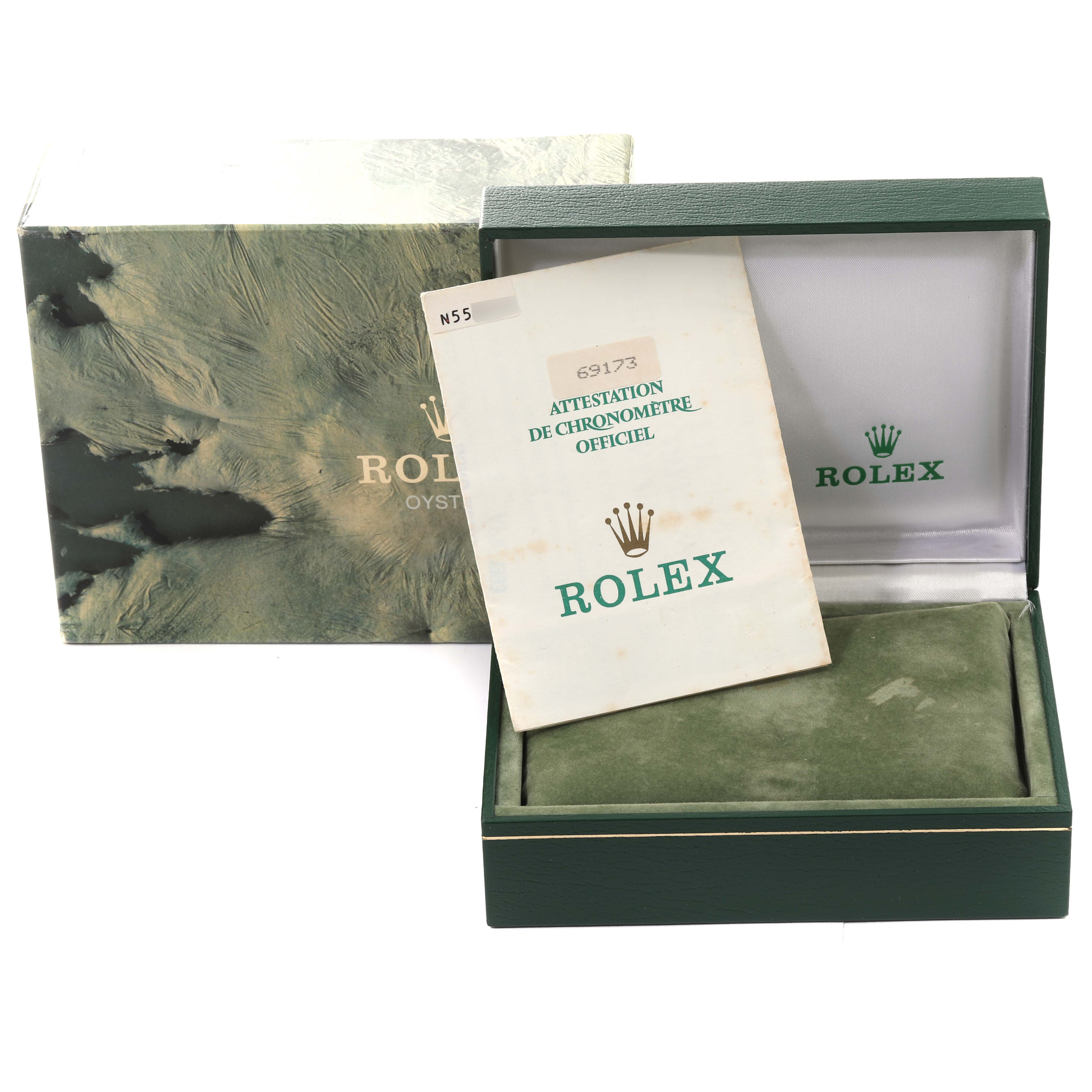 The image shows a Rolex Datejust 69173 Women's Steel and Gold (two tone) Grey Dial 69173 Women's Steel and Gold (two tone) Grey Dial watch box and its certificate of authenticity, angled slightly open to display the inside.