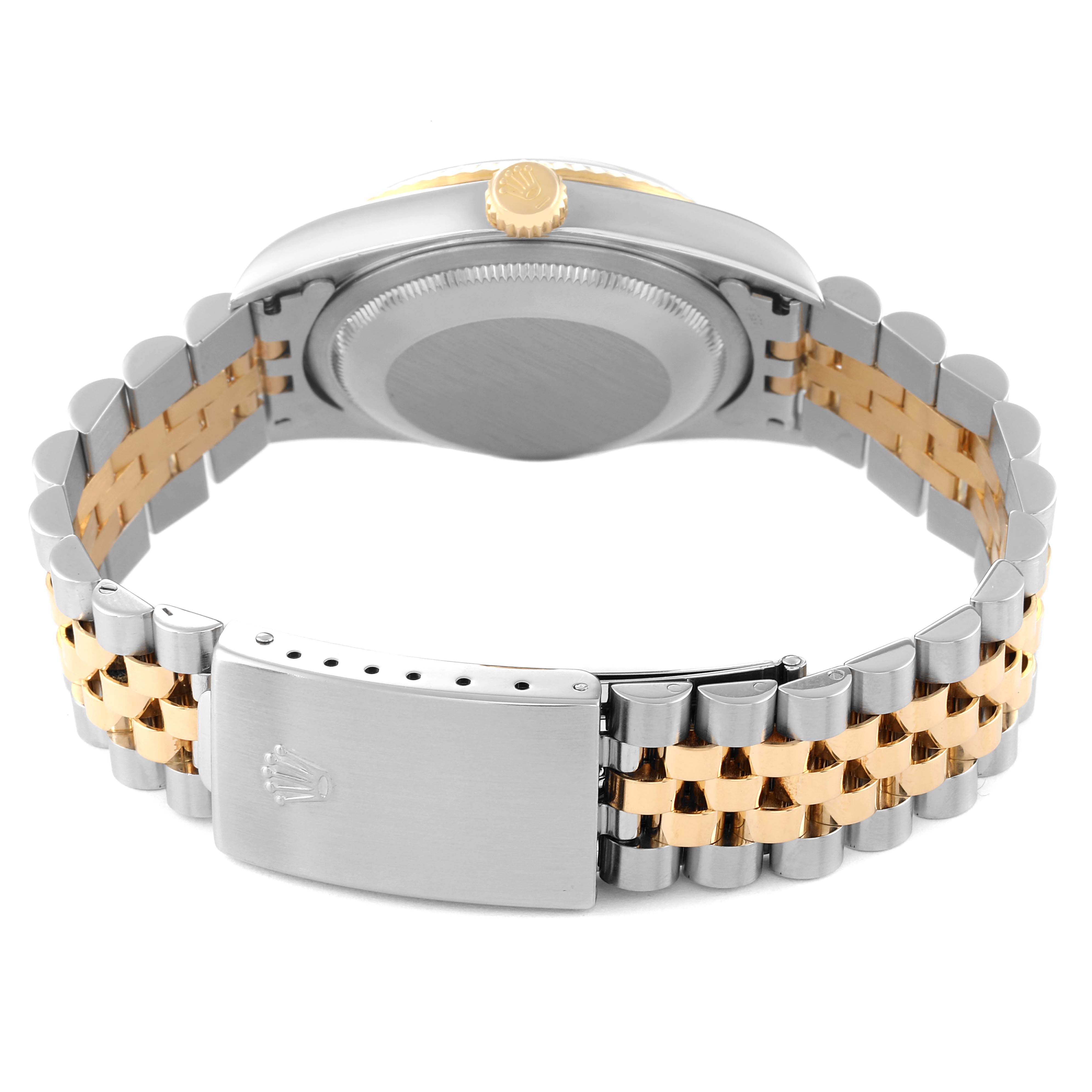 This Rolex Datejust 16233 Men's Steel and Gold (two tone) Black Dial 16233 Men's Steel and Gold (two tone) Black Dial watch is shown from the back, highlighting the case back, two-tone bracelet, and clasp.