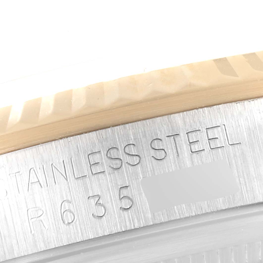 Close-up of the case side of a Rolex Datejust 16233 Men's Steel and Gold (two tone) Champagne Dial 16233 Men's Steel and Gold (two tone) Champagne Dial watch, showing the "STAINLESS STEEL" engraving.
