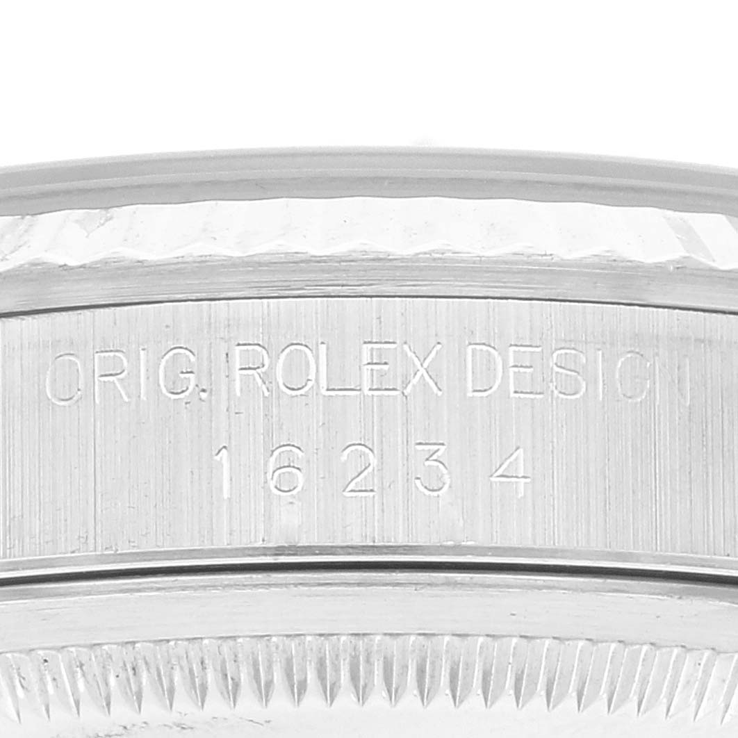 This image shows a close-up of the engraving on the case side of a Rolex Datejust 16234 Men's Stainless Steel Black Dial 16234 Men's Stainless Steel Black Dial Model 16234.