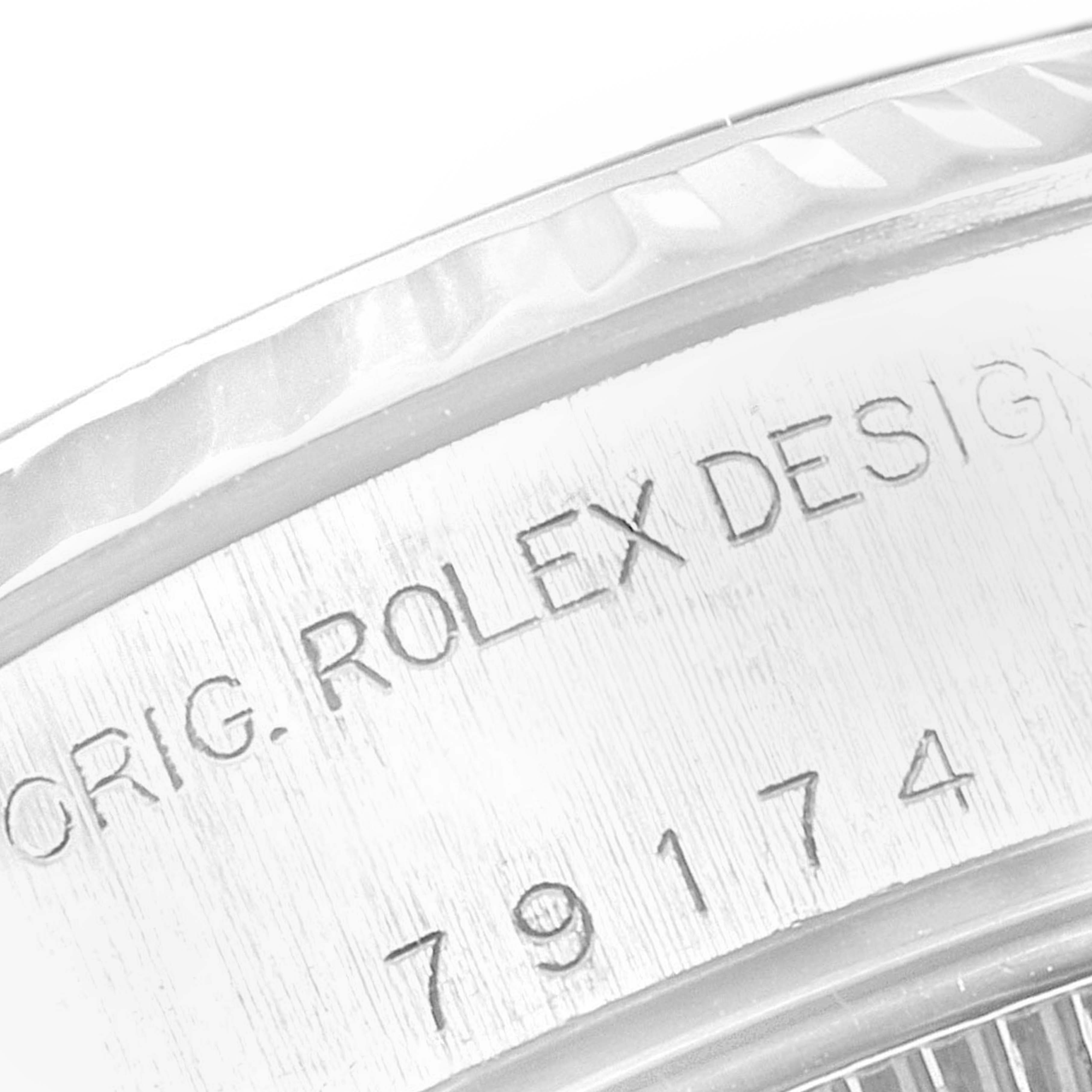 This close-up image shows the side engraving on the casing of a Rolex Datejust 79174 Women
s Stainless Steel Silver Dial 79174 Women
s Stainless Steel Silver Dial watch.