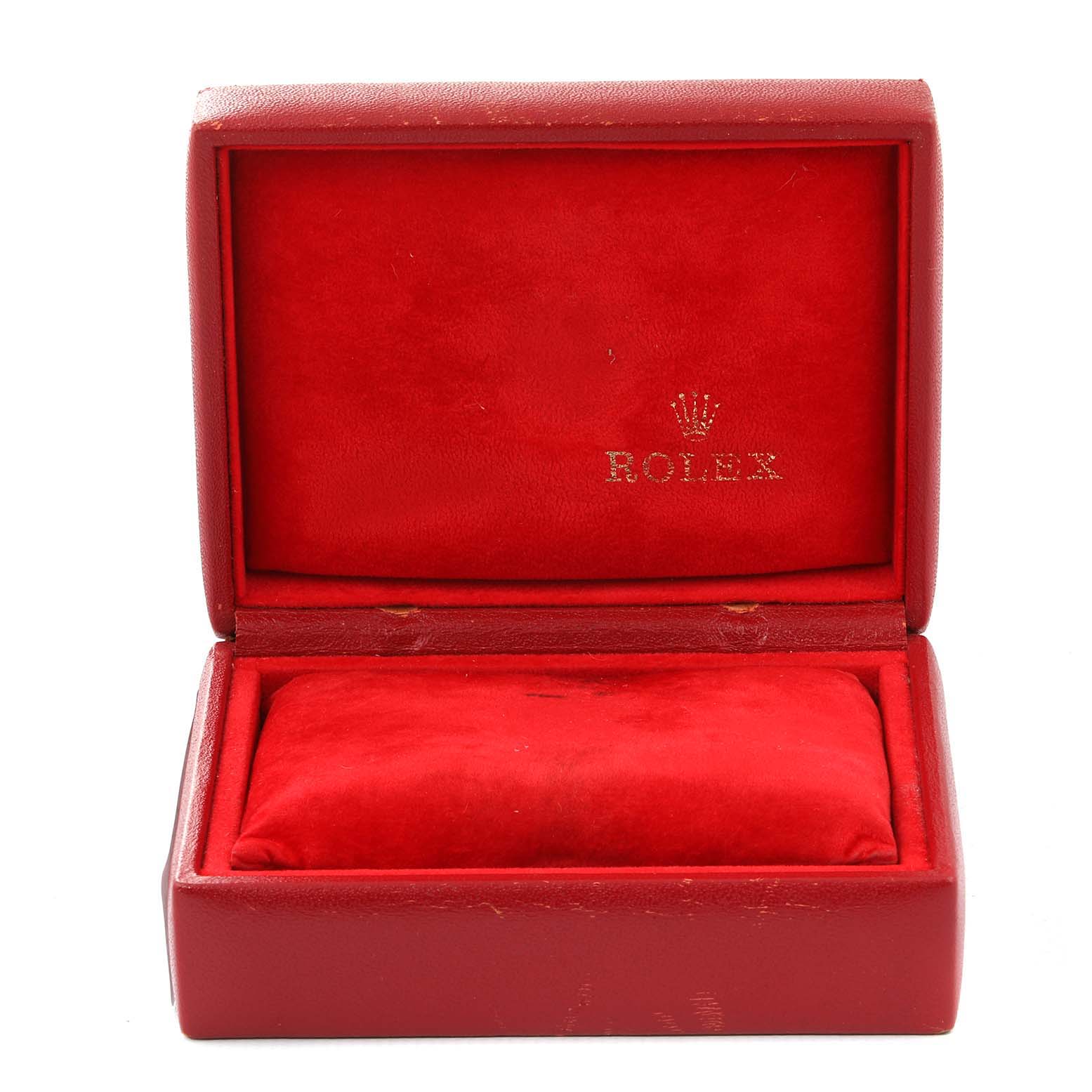 This image shows an open red case for a Rolex Datejust 79174 Women
s Stainless Steel Silver Dial 79174 Women
s Stainless Steel Silver Dial watch, displaying the branded interior.