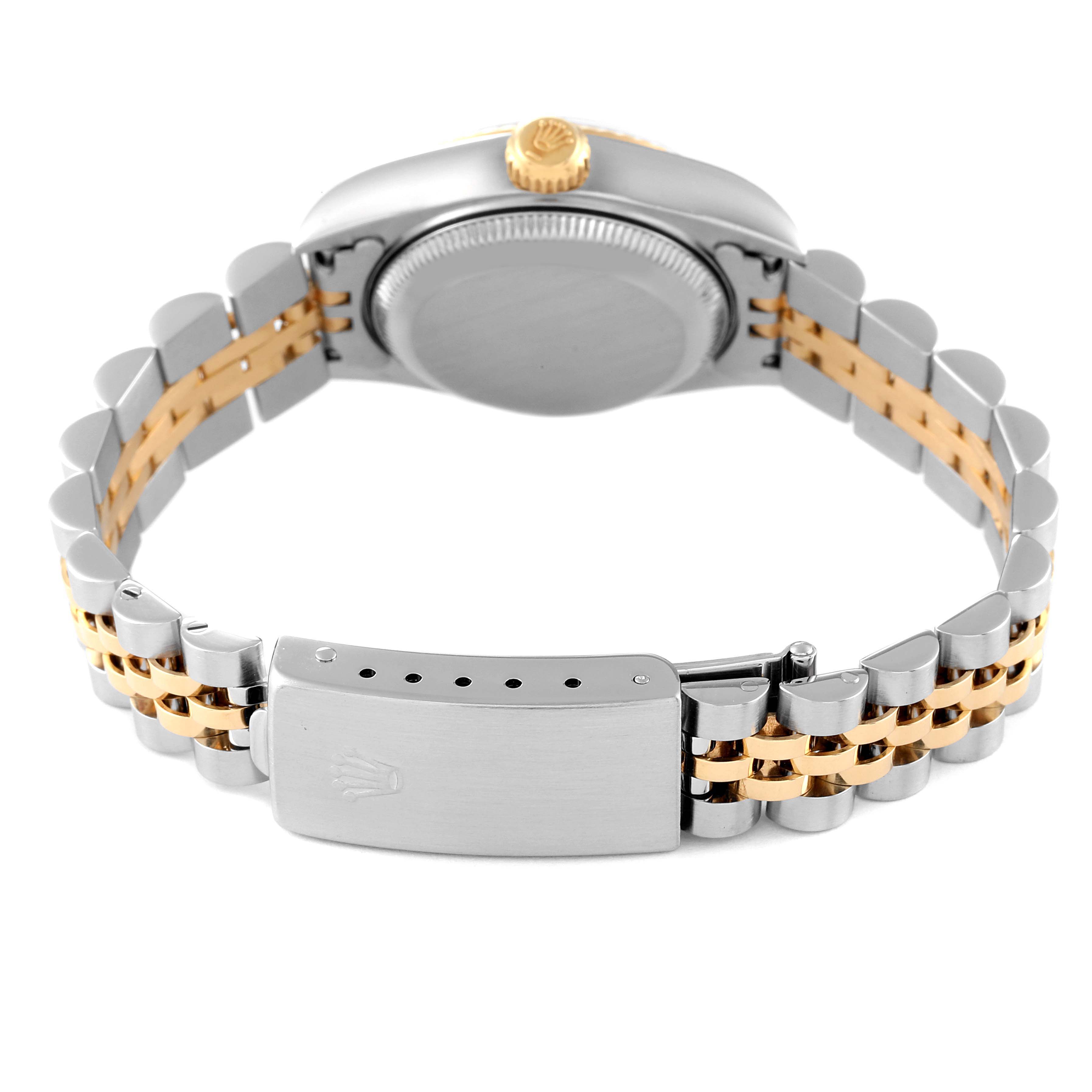 This image shows the back of the Rolex Datejust 79173 Women's Steel and Gold (two tone) Champagne Dial 79173 Women's Steel and Gold (two tone) Champagne Dial watch, highlighting its case, crown, and two-tone Jubilee bracelet clasp.