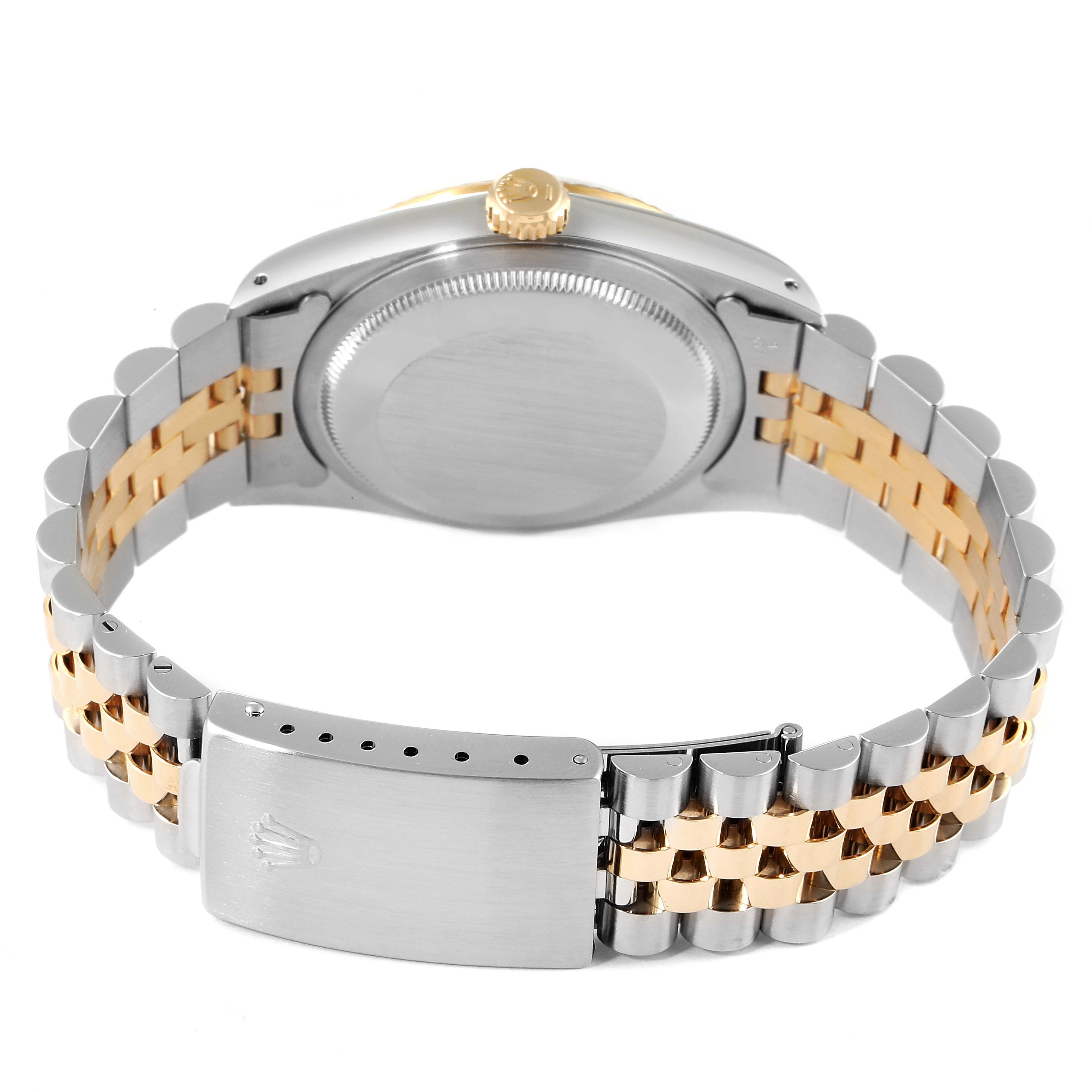 The image shows the back case and bracelet of a Rolex Datejust 16233 Men's Steel and Gold (two tone) White Dial 16233 Men's Steel and Gold (two tone) White Dial watch, featuring a two-tone metal design.