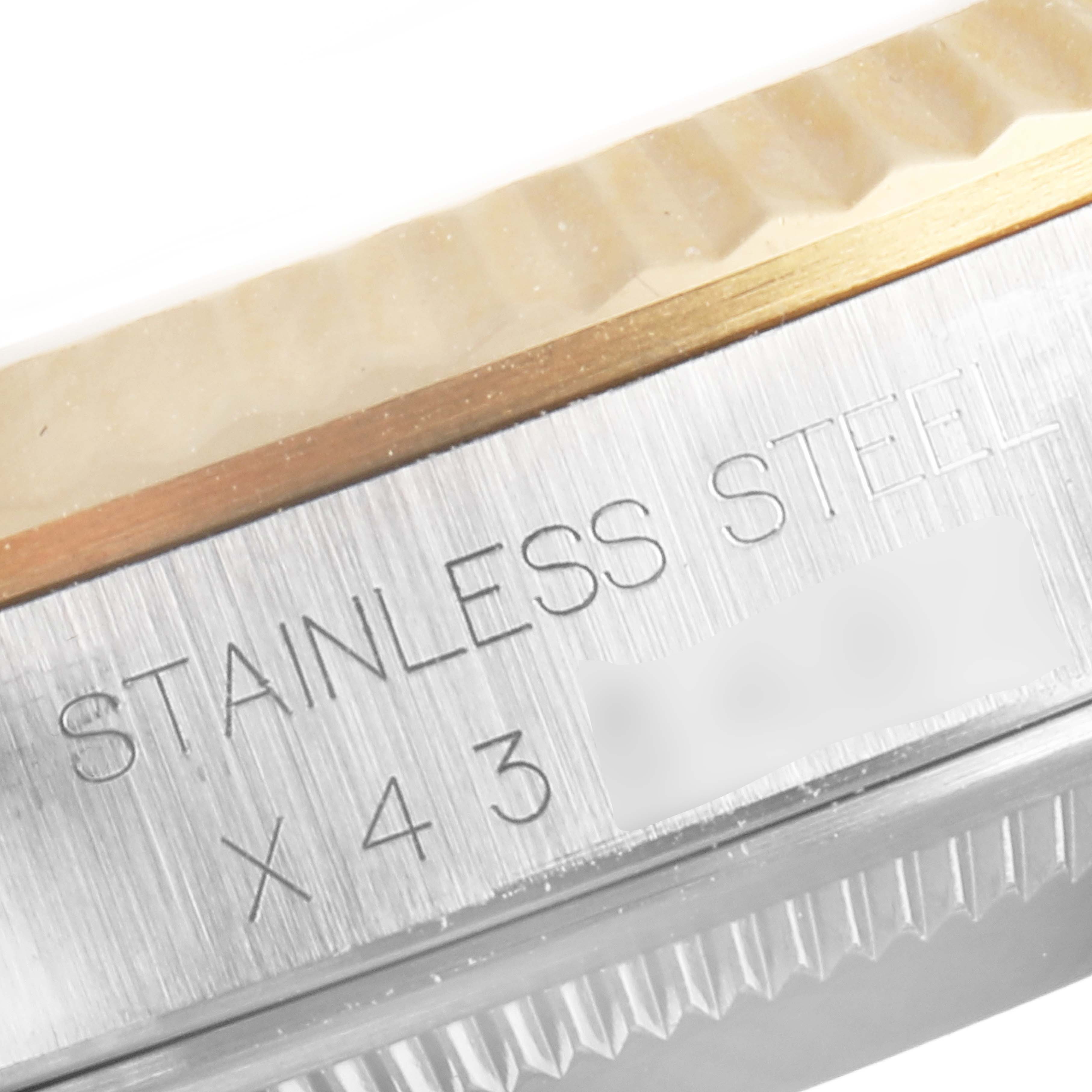 This is a close-up of the case side of a Rolex Datejust 16233 Men's Steel and Gold (two tone) White Dial 16233 Men's Steel and Gold (two tone) White Dial, showing the "STAINLESS STEEL" engraving and part of the bezel.