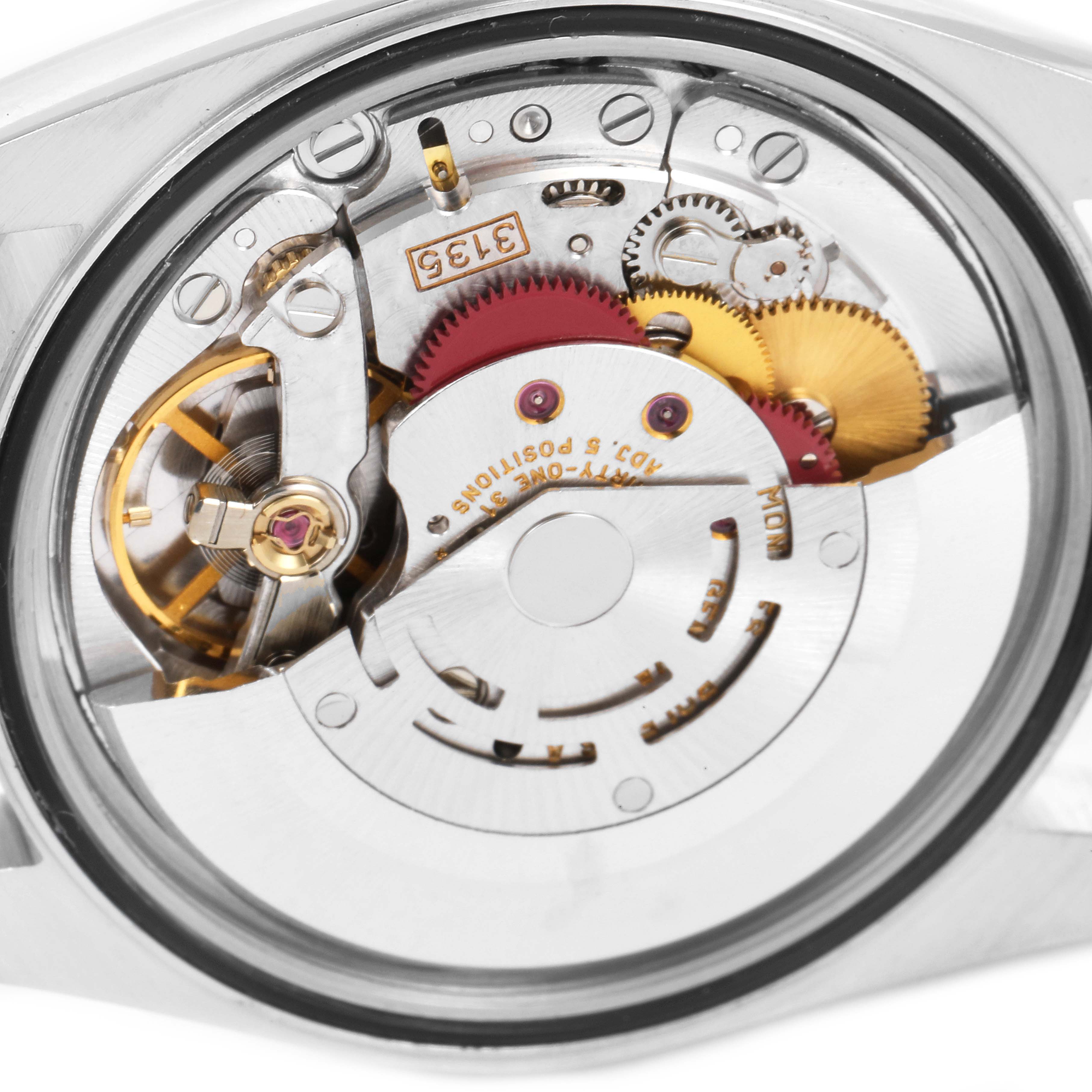 This image shows the internal mechanism with gears and parts of a Rolex Datejust 16233 Men's Steel and Gold (two tone) White Dial 16233 Men's Steel and Gold (two tone) White Dial watch from the back.