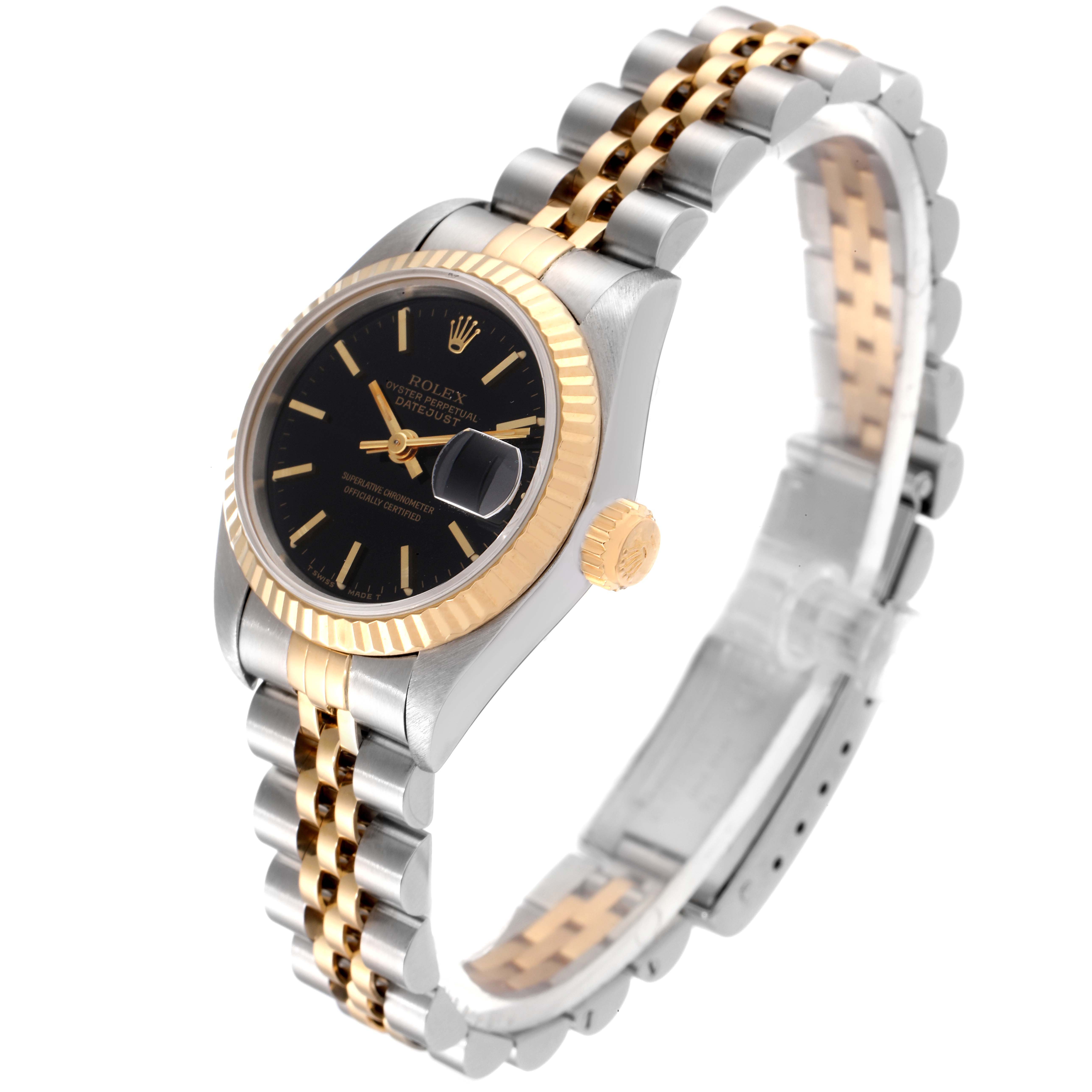 The image shows a side-angle view of a Rolex Datejust 69173 Women
s Steel and Gold (two tone) Black Dial 69173 Women
s Steel and Gold (two tone) Black Dial watch, highlighting the black dial, fluted bezel, and two-tone bracelet with clasp.