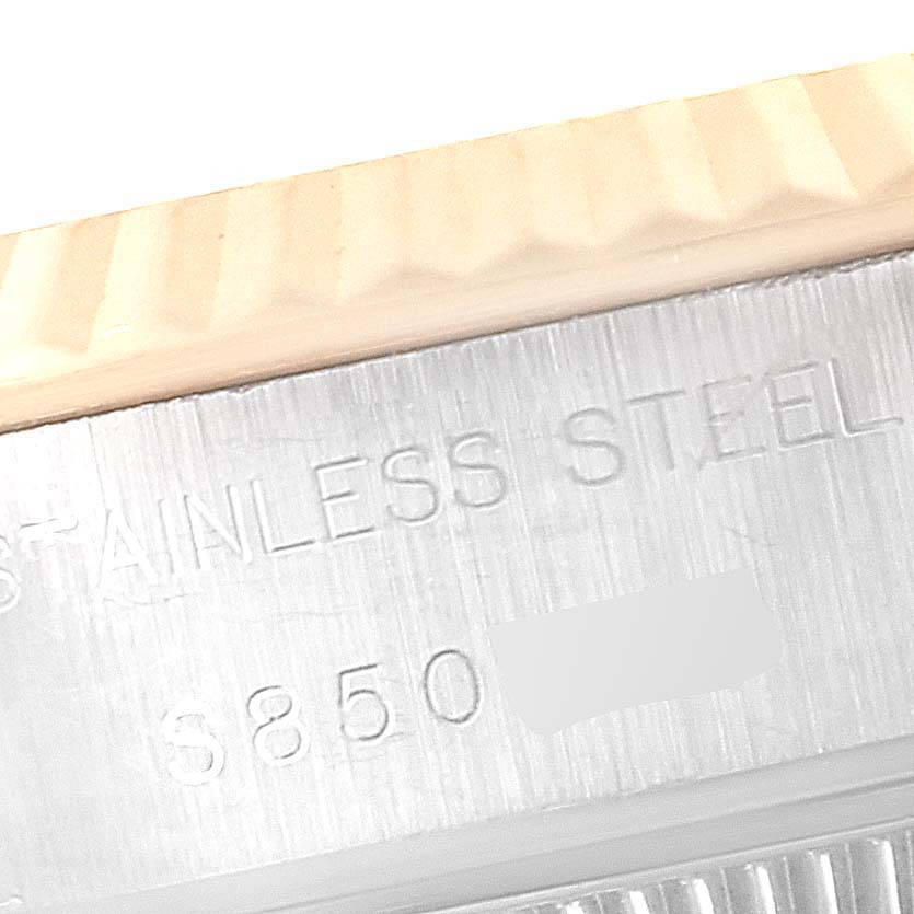 This image shows a close-up of the stainless steel case and bezel of a Rolex Datejust 69173 Women
s Steel and Gold (two tone) Black Dial 69173 Women
s Steel and Gold (two tone) Black Dial watch, highlighting the serial number.