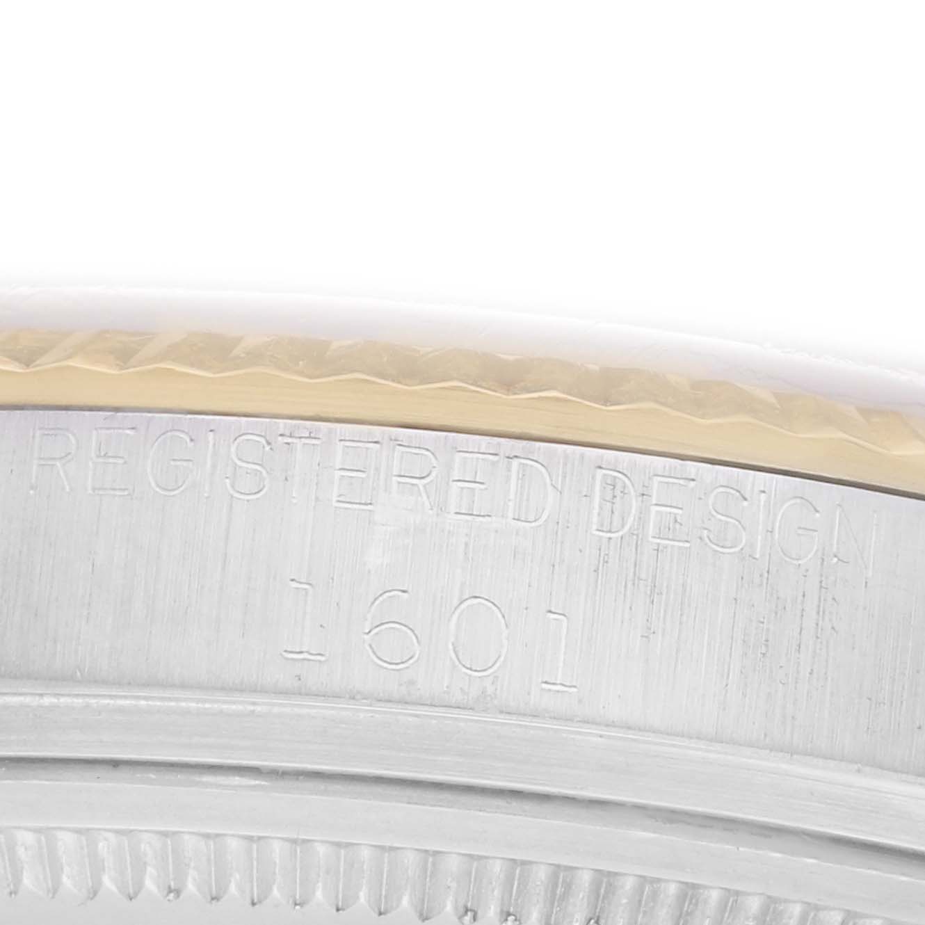 The image shows a close-up side view of the Rolex Datejust model 1601, focusing on the engraved model number and the edge of the bezel.