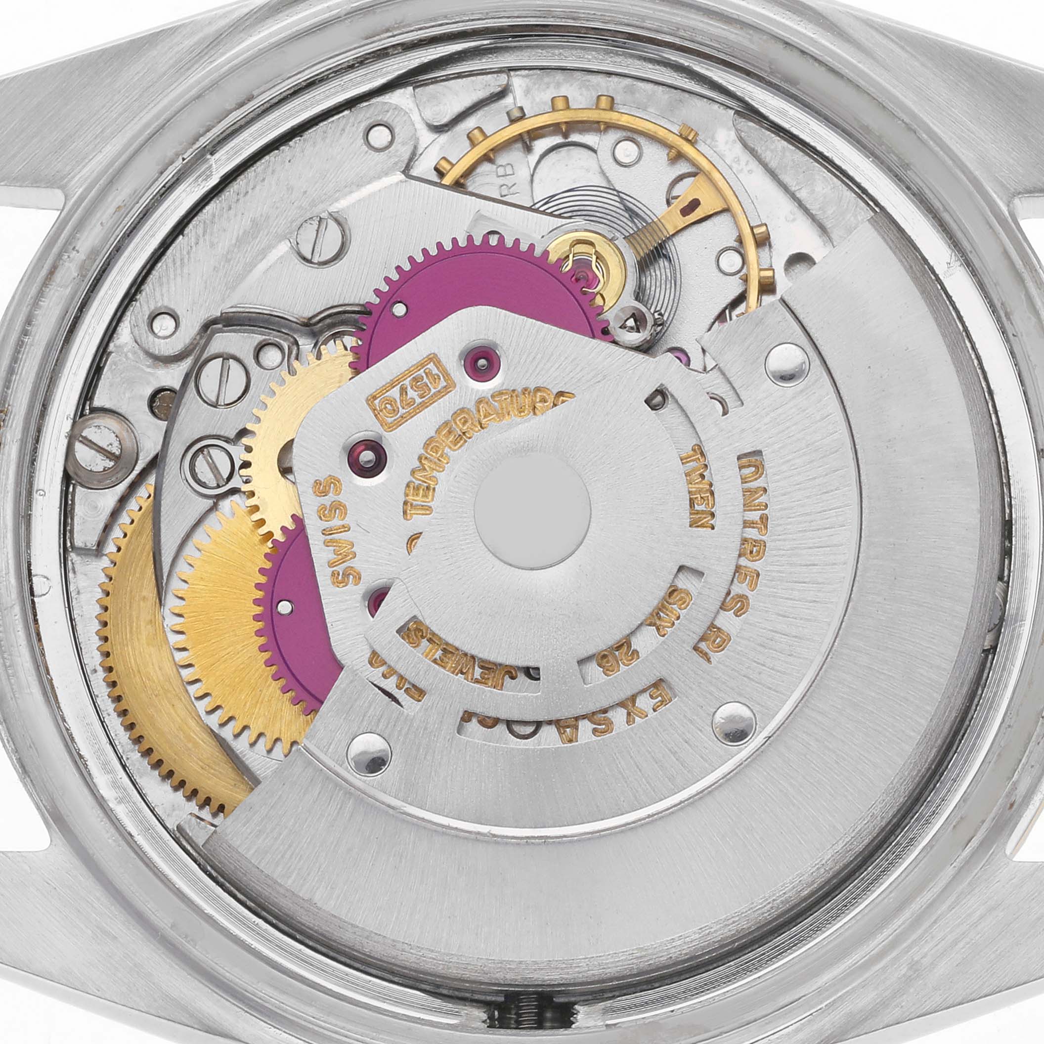 The image shows the internal movement of a Rolex Datejust model 1601 men
s watch, with visible gears and the rotor mechanism.