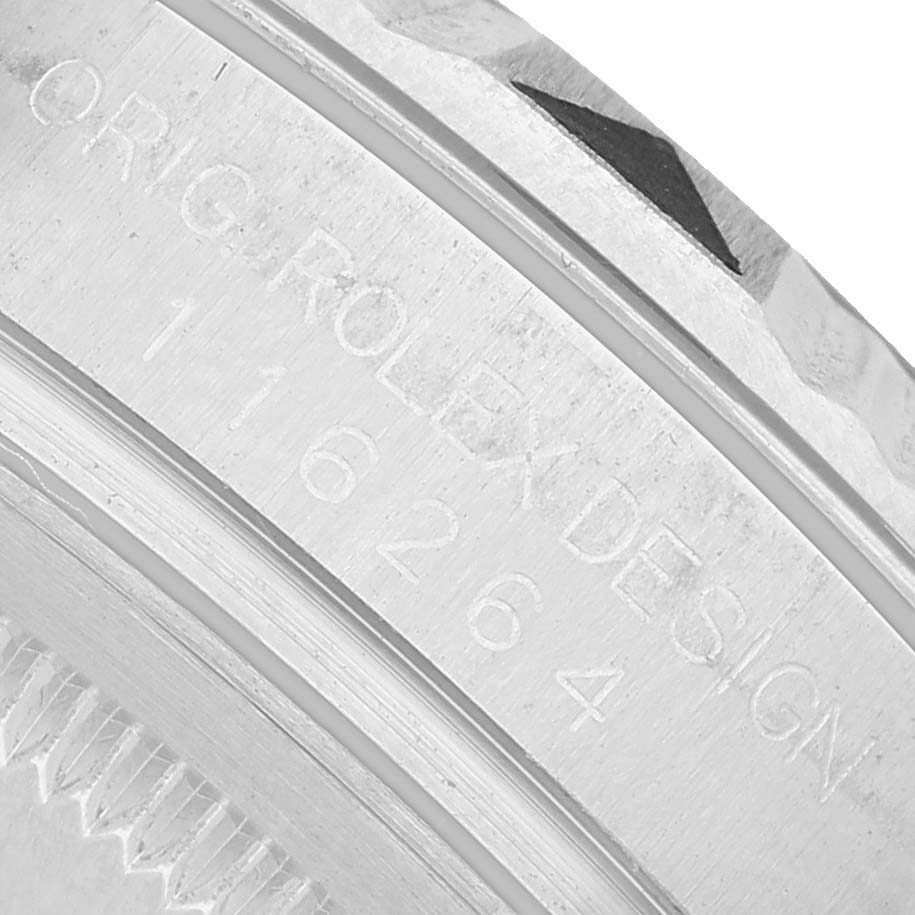 The image shows a close-up of the bezel and engraved side of the Rolex Datejust 116264 Men's Stainless Steel Black Dial watch.
