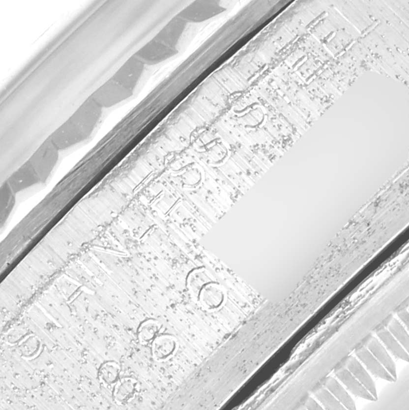 This close-up image shows the engraved serial number on the case of a Vintage Collection model by Rolex.