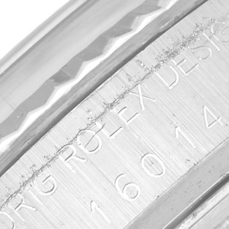 The image shows a close-up of the engraved side of the Rolex Vintage Collection 16014 Men's Stainless Steel Blue Dial 16014 Men's Stainless Steel Blue Dial model watch.