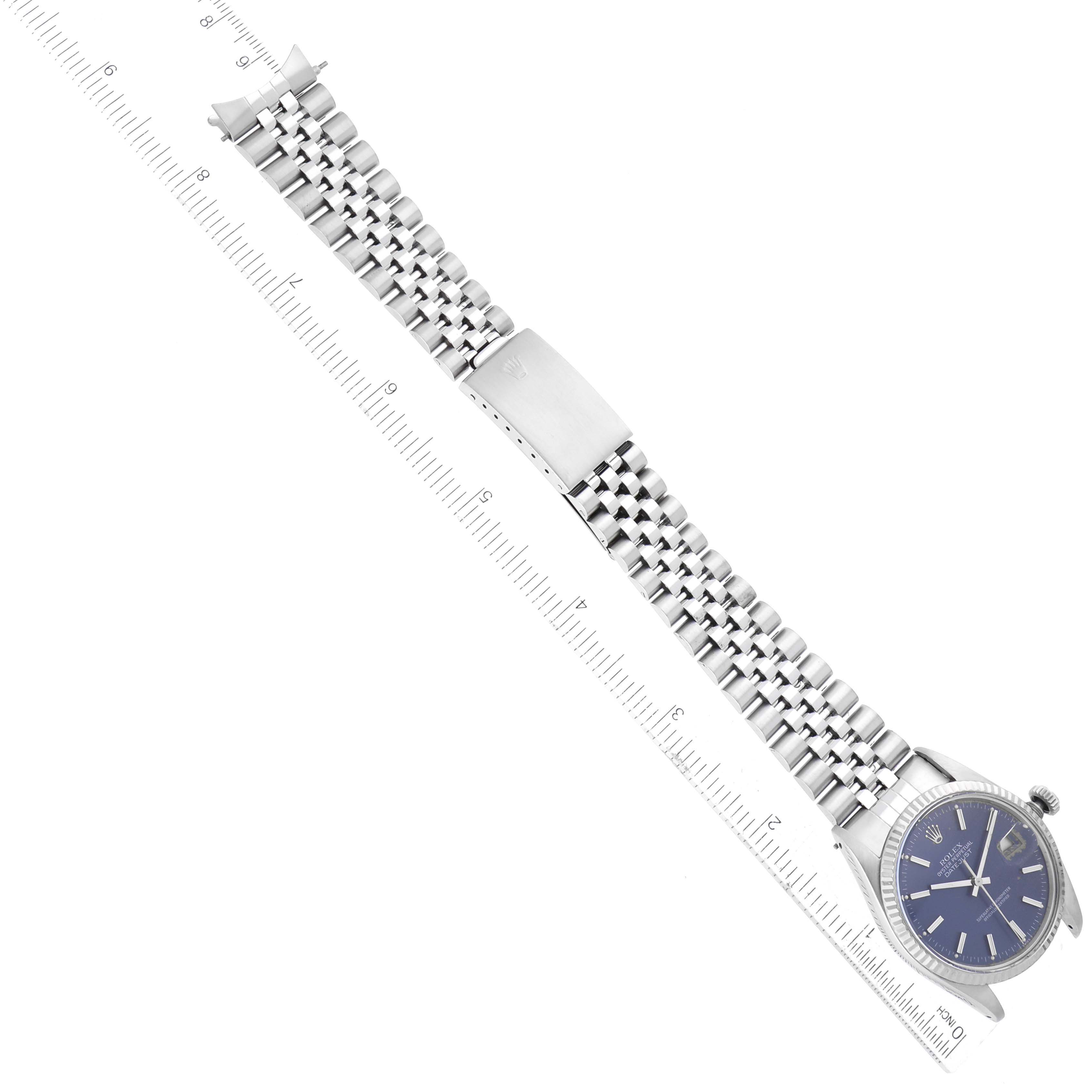 The image shows an overhead view of the Rolex Vintage Collection 16014 Men's Stainless Steel Blue Dial 16014 Men's Stainless Steel Blue Dial watch, highlighting its face and metal bracelet.