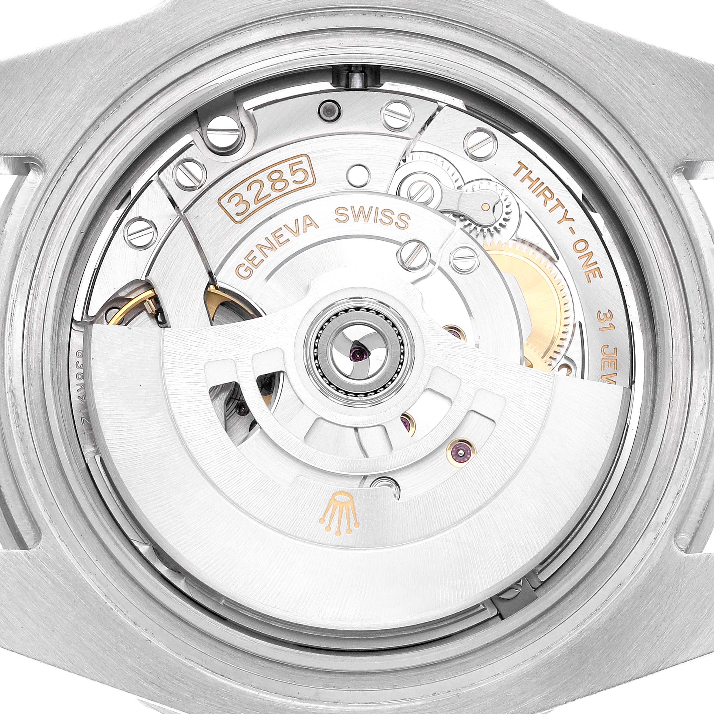 The image shows the movement of the Rolex GMT-Master, model 126710, highlighting the rotor, bridge, and other components from a rear angle.