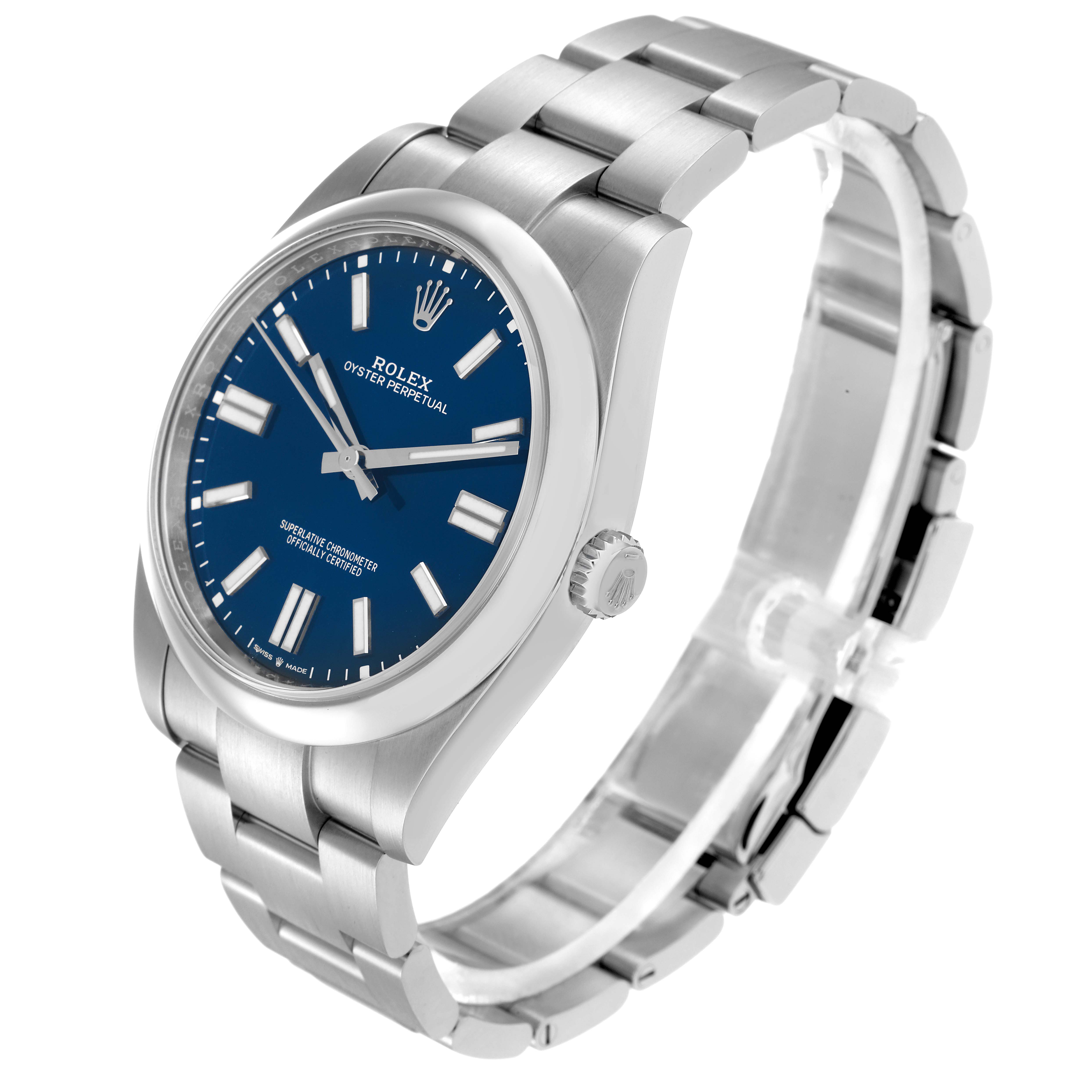 The Rolex Oyster Perpetual model 124300 is shown at a three-quarter angle, highlighting its blue dial, hour markers, crown, and stainless steel bracelet.