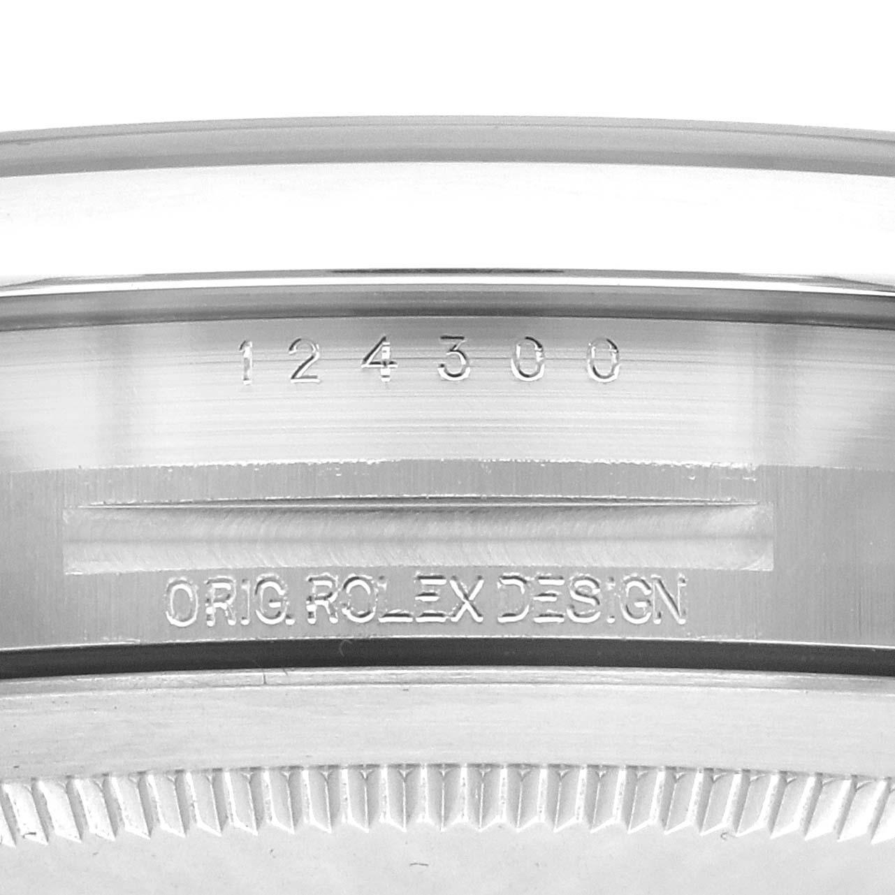 The image shows a close-up of the side of a Rolex Oyster Perpetual model 124300, focusing on the engraved model number.