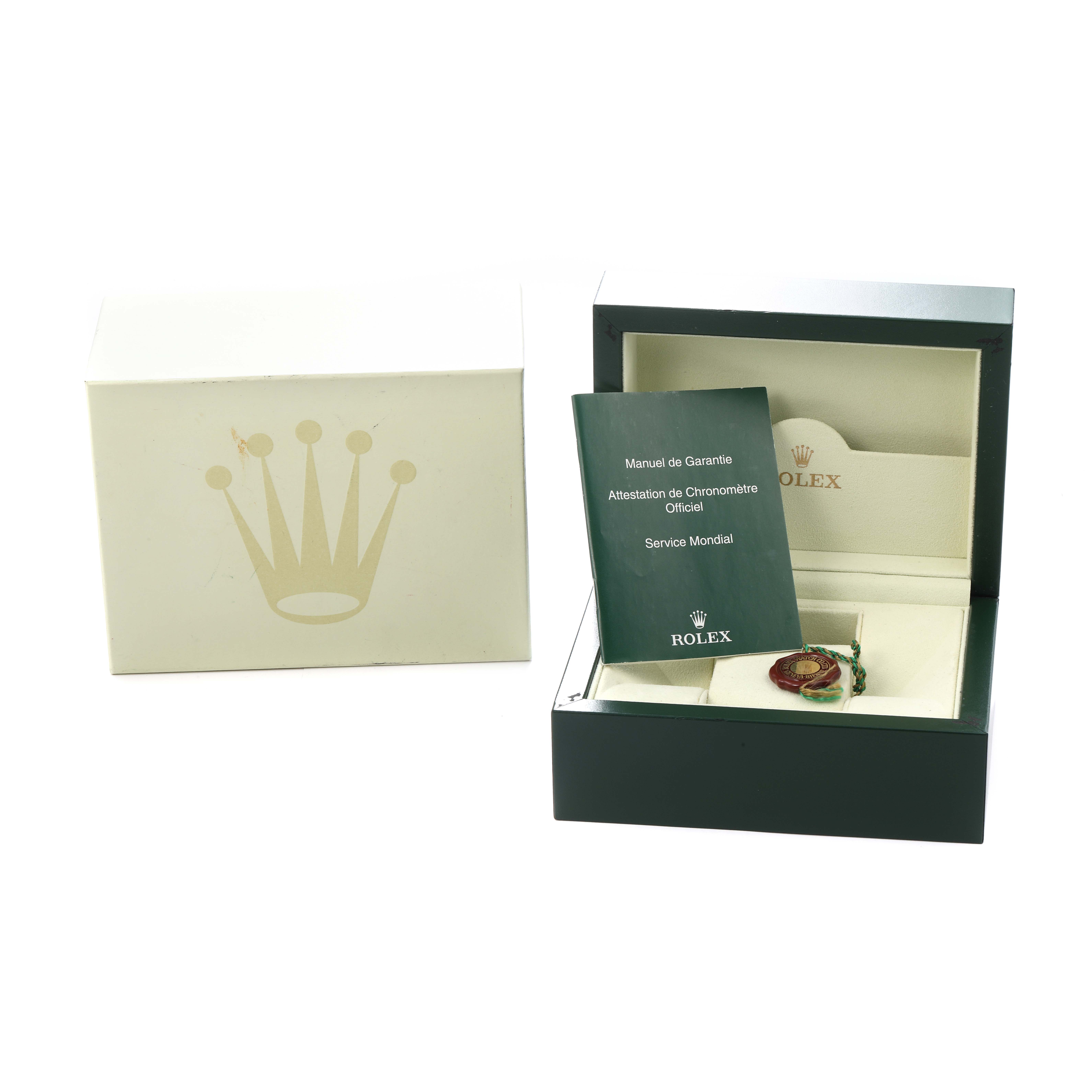 The image shows the packaging and accessories for a Rolex Air-King model 114210, including a green box, warranty booklet, and a tag inside the main box.