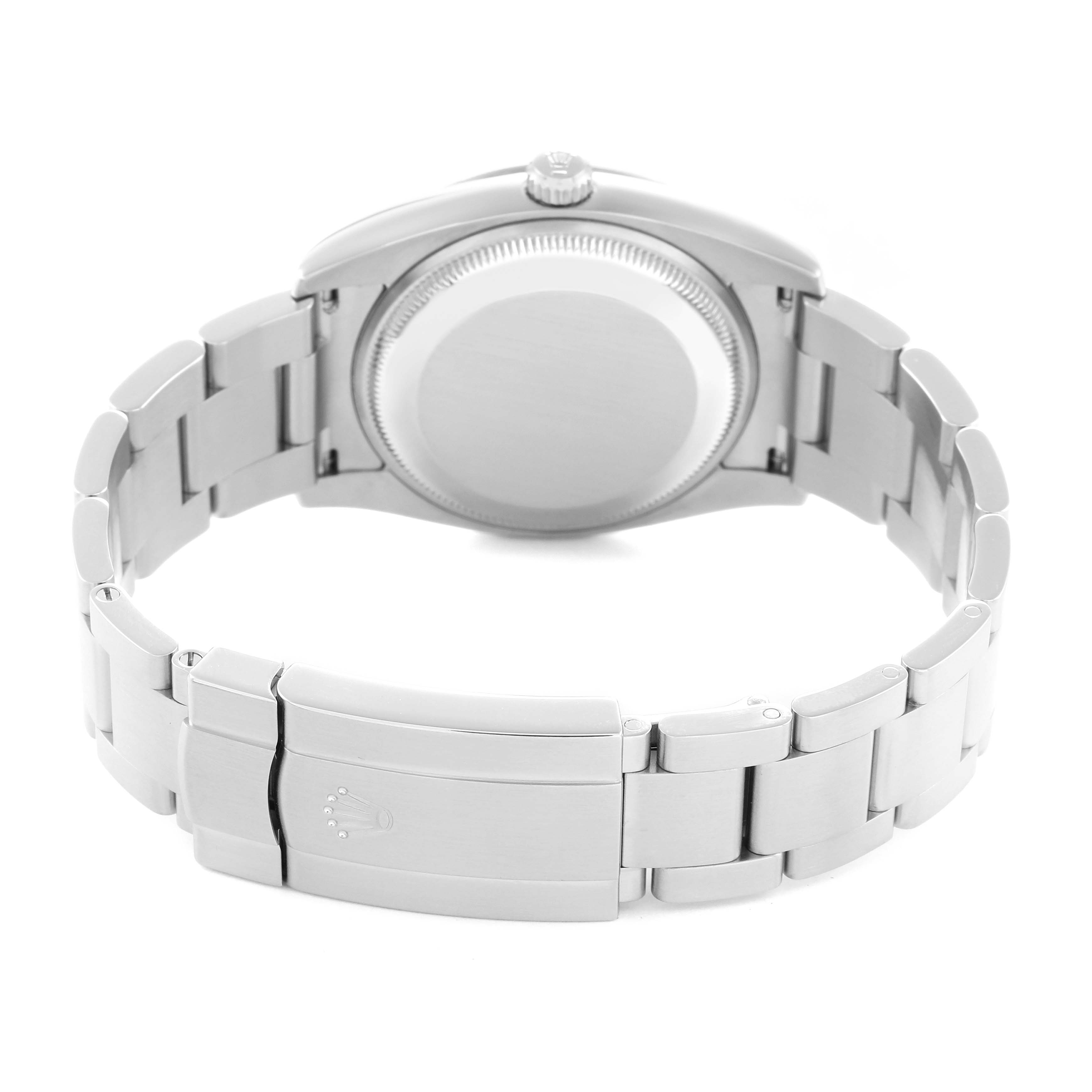 The image shows the back of a Rolex Air-King model 114210 men
s watch, highlighting the case back and metal bracelet with the clasp visible.