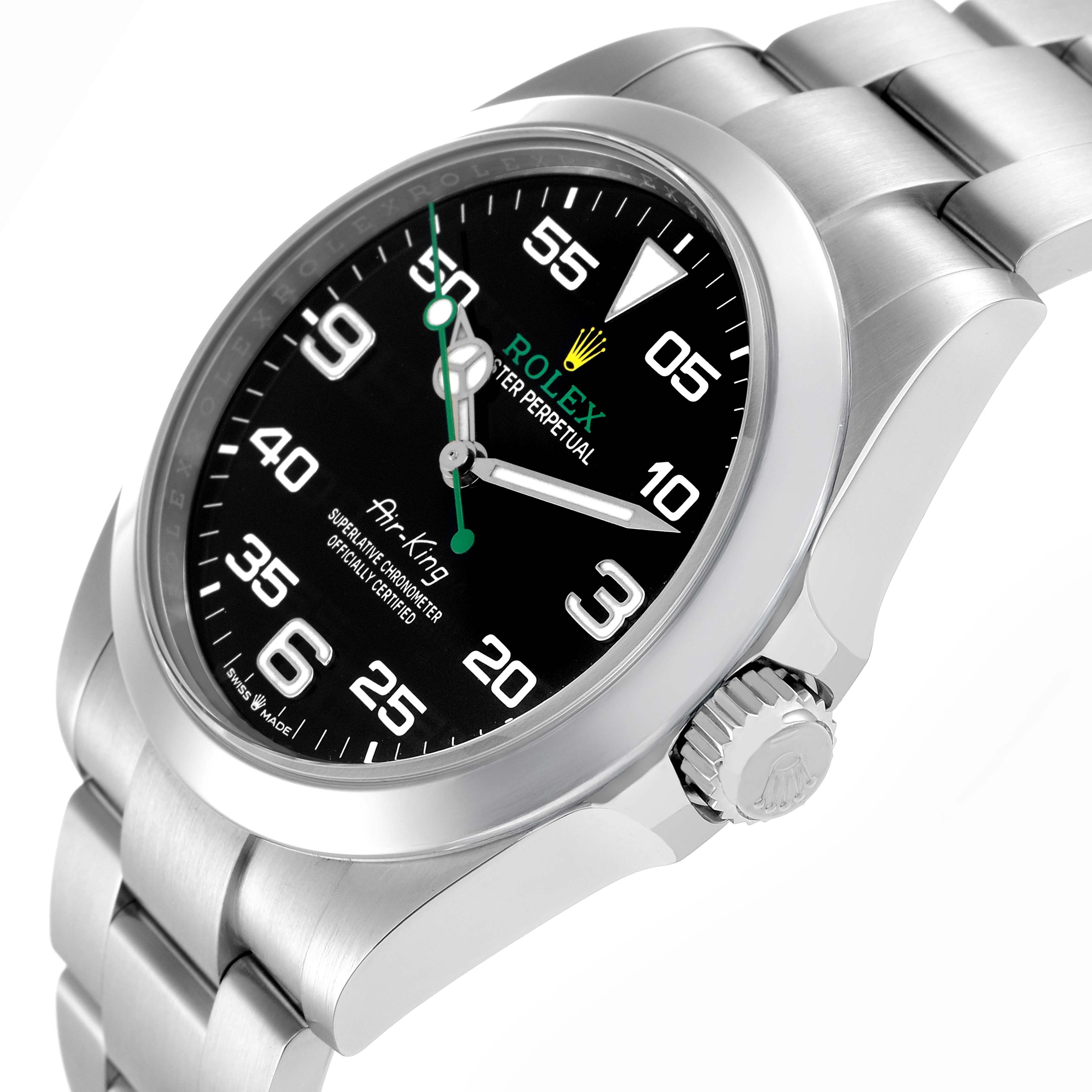 The Rolex Air-King model 126900 is shown at a slight side angle, displaying its black dial, crown, and portion of the bracelet.