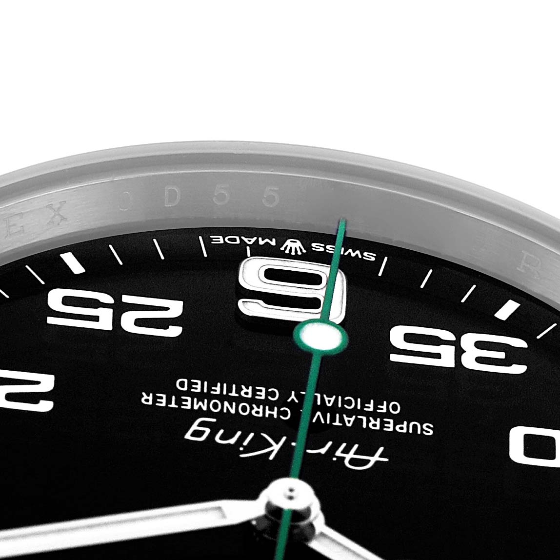 The image shows a close-up of the Rolex Air-King model 126900 watch face, highlighting the hour markers, brand name, and part of the second hand.