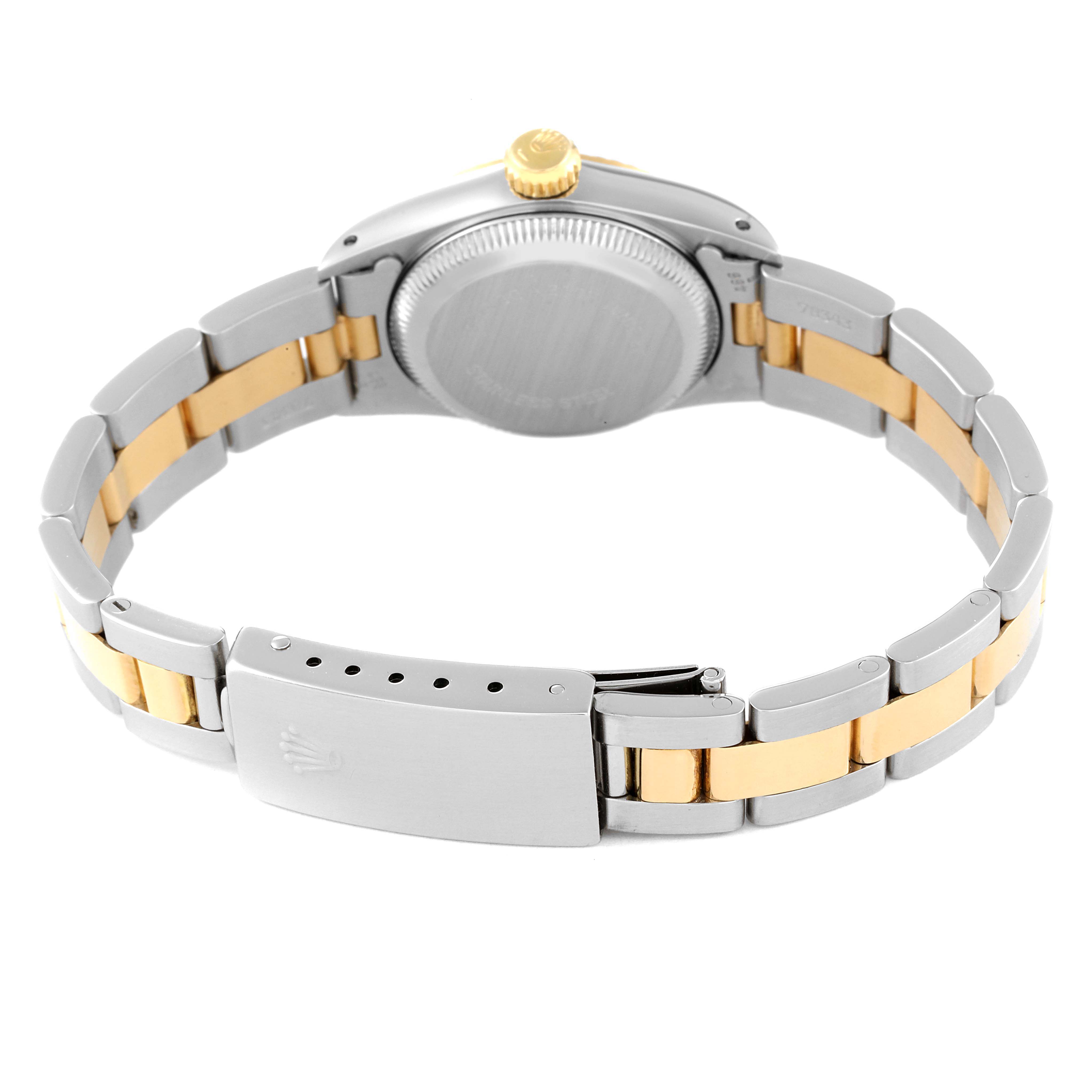 This image shows the back view of a Rolex Oyster Perpetual 67193 Women's Steel and Gold (two tone) Champagne Dial 67193 Women's Steel and Gold (two tone) Champagne Dial watch, highlighting its case back, bracelet links, and clasp.