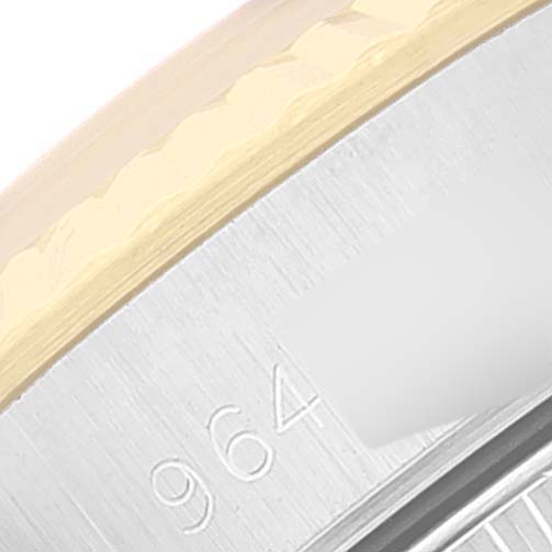 The image shows a close-up of the side of the bezel and part of the dial (serial number area) of a Rolex Oyster Perpetual 67193 Women's Steel and Gold (two tone) Champagne Dial 67193 Women's Steel and Gold (two tone) Champagne Dial watch.