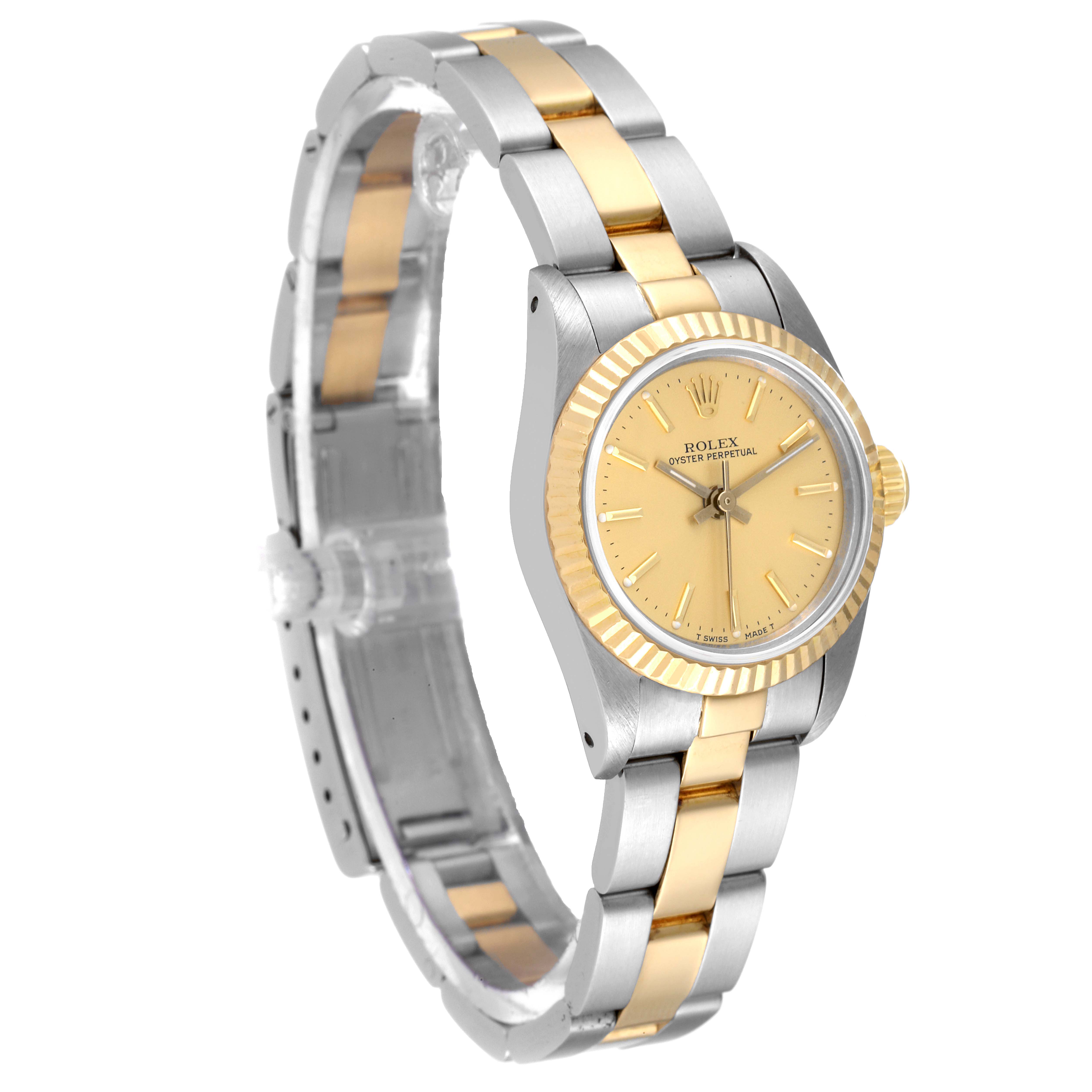 The image shows a Rolex Oyster Perpetual 67193 Women's Steel and Gold (two tone) Champagne Dial 67193 Women's Steel and Gold (two tone) Champagne Dial watch at an angle, highlighting its bezel, dial, and two-tone bracelet.