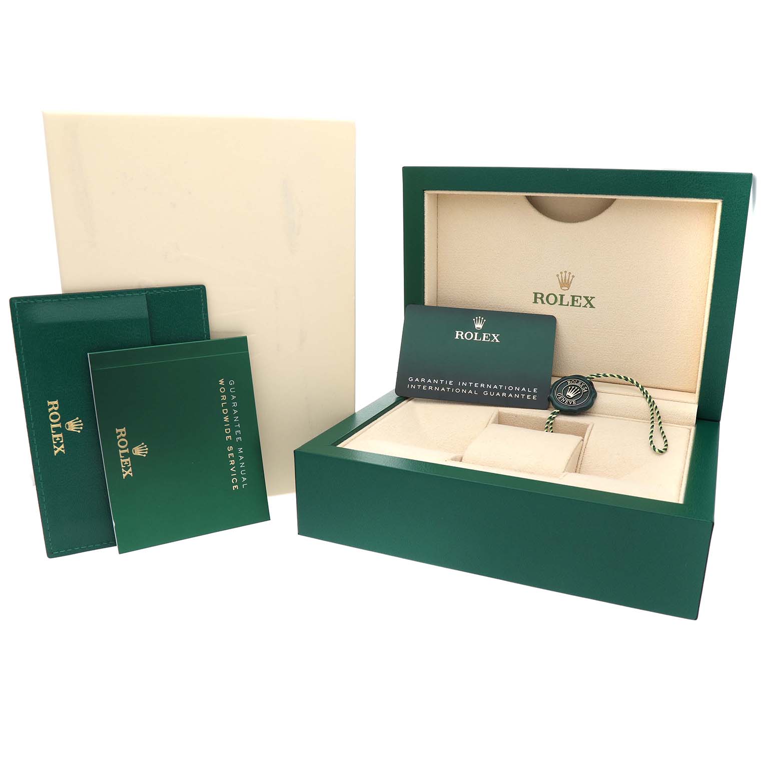 The image shows the open packaging and accessories of a Rolex Oyster Perpetual 277200 Women's Stainless Steel Green Dial, including the box, cards, and hangtag.