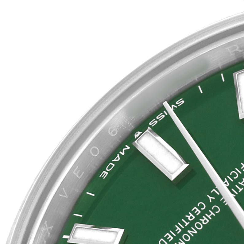 The image shows a close-up of the Rolex Oyster Perpetual 277200 Women's Stainless Steel Green Dial watch, focusing on the green dial, hour markers, and part of the bezel.