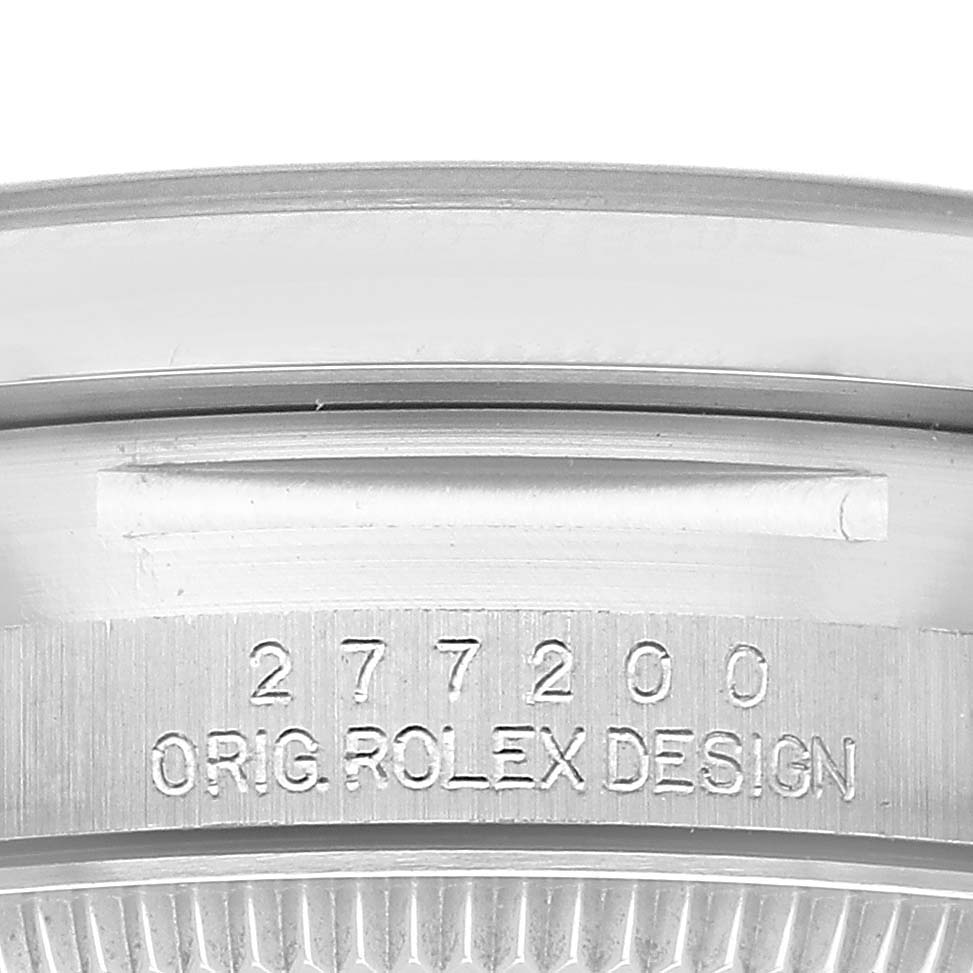 The image shows the side engraving of the bezel on a Rolex Oyster Perpetual 277200 Women's Stainless Steel Green Dial watch.