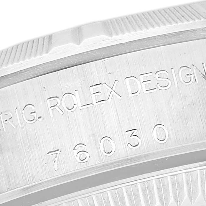 This close-up image shows the engraved bezel and model number of the Rolex Oyster Perpetual 76030 Women's Stainless Steel White Dial 76030 Women's Stainless Steel White Dial watch.