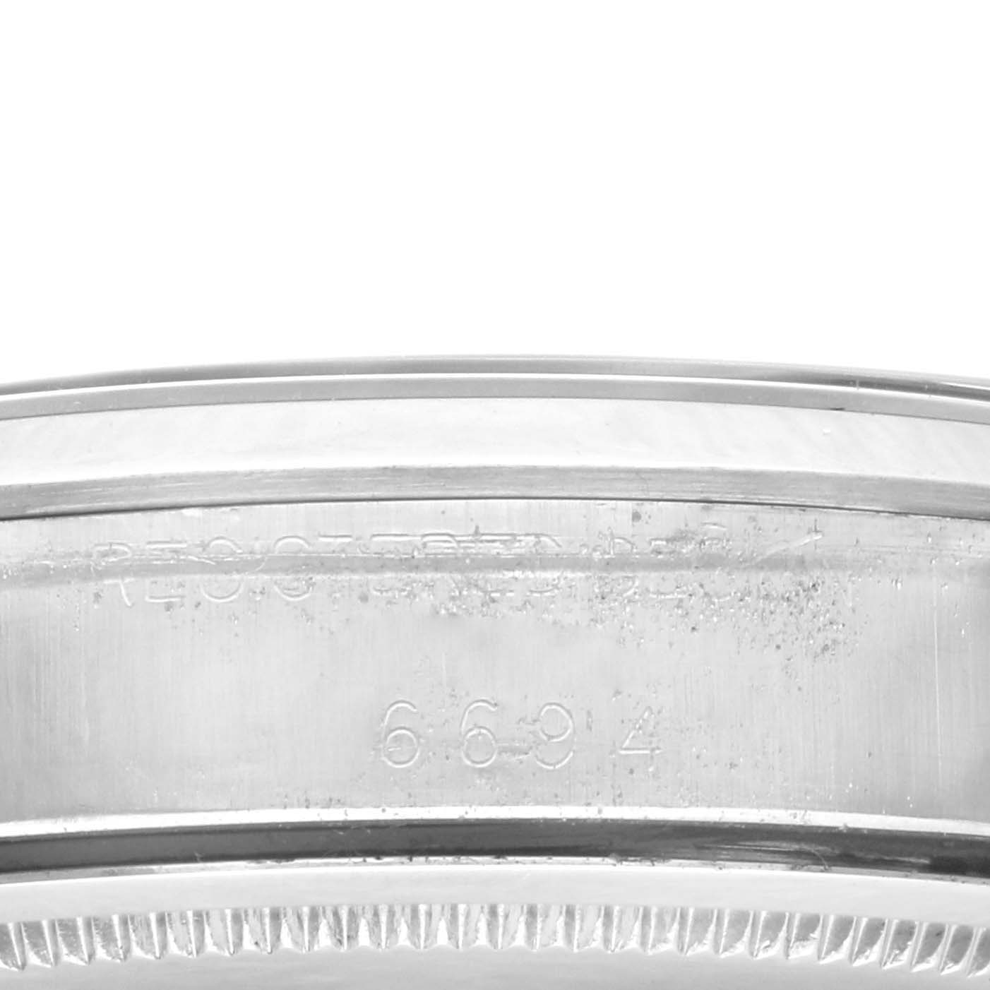 This image shows a close-up of the case back and serial engraving of the Rolex Vintage Collection 6694 Men's Stainless Steel Blue Dial 6694 Men's Stainless Steel Blue Dial watch model 6694.