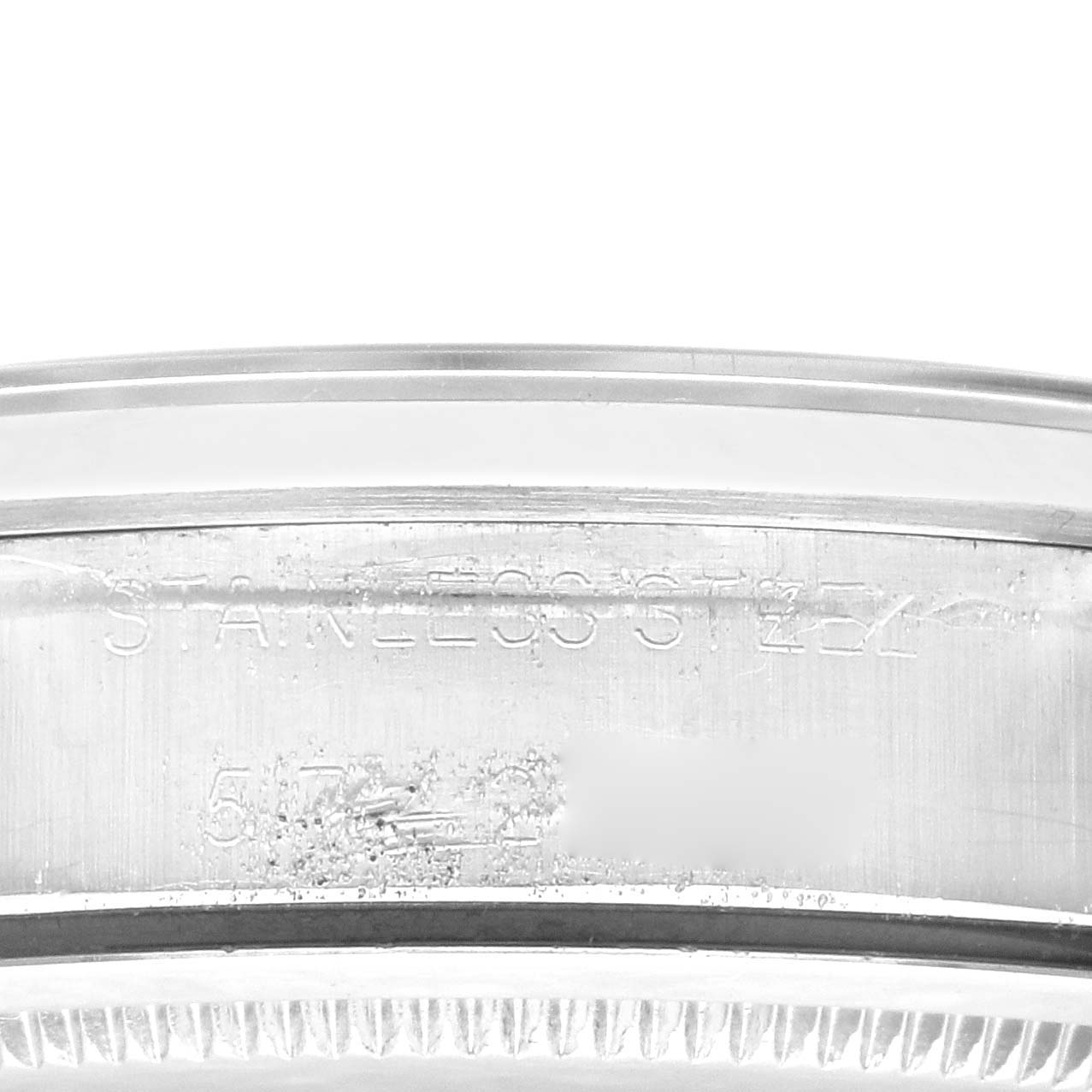 This image shows a close-up of the engraving on the stainless steel case of the Rolex Vintage Collection 6694 Men's Stainless Steel Blue Dial 6694 Men's Stainless Steel Blue Dial watch.