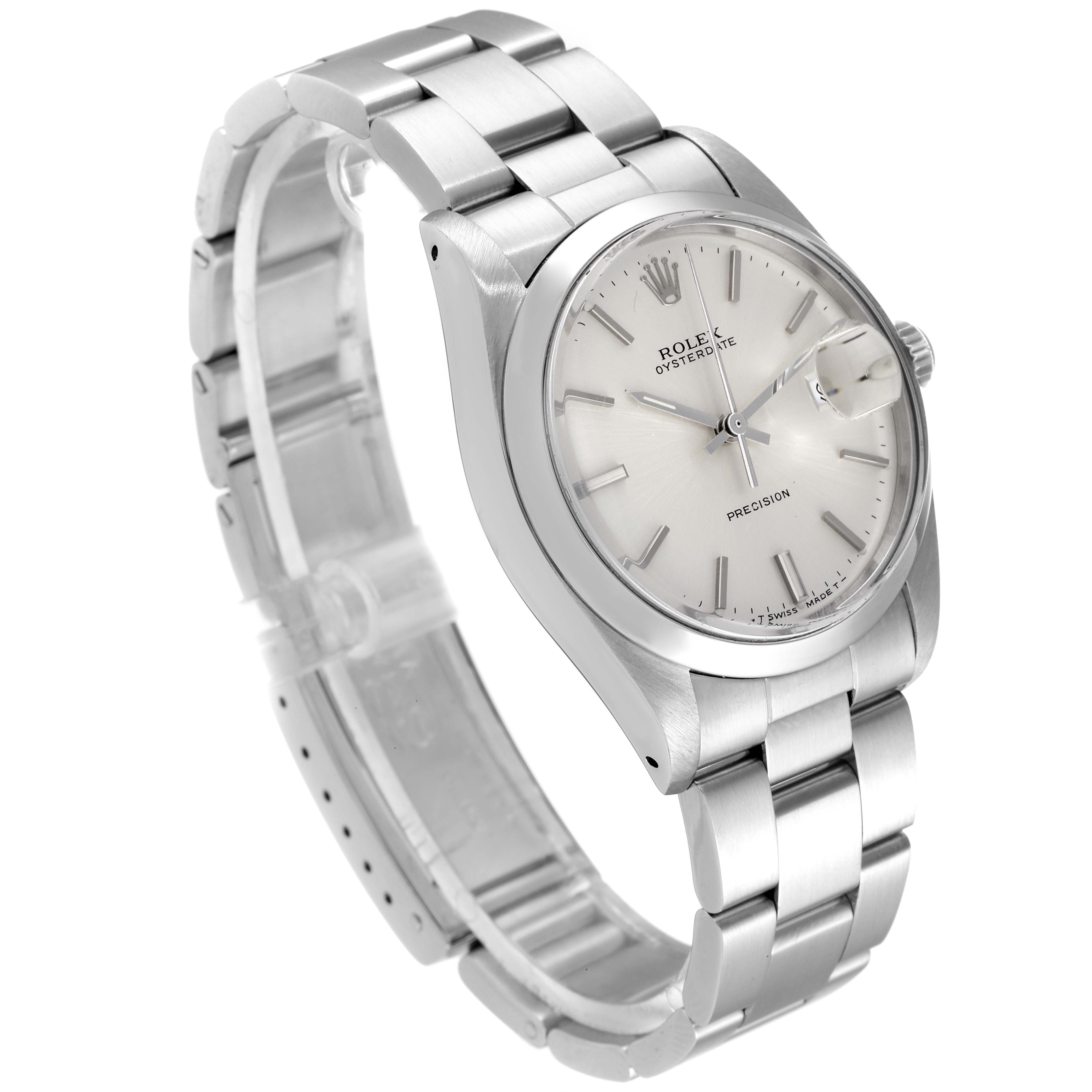 The Vintage Collection Rolex watch is shown from an angled view, highlighting the face, bezel, and metal bracelet.