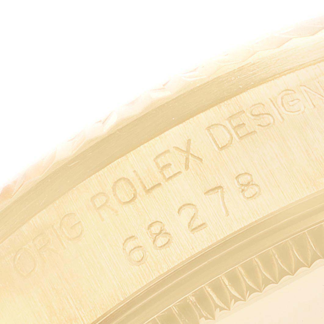 This image shows a close-up angle of the case edge with engraved markings of a Rolex President 68278 Women
s Yellow Gold Champagne Dial 68278 Women
s Yellow Gold Champagne Dial model watch.