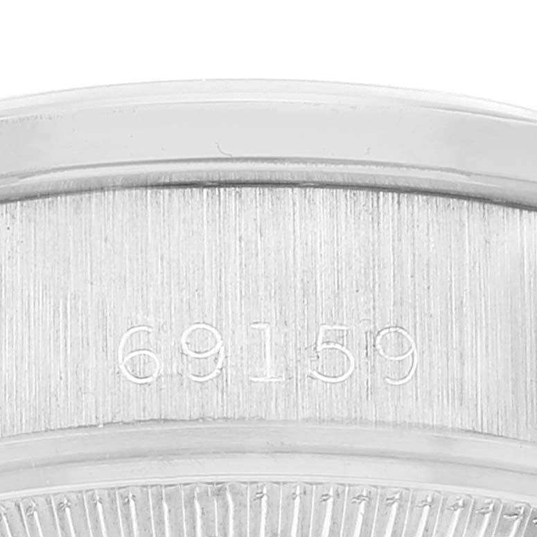 This image shows a close-up of the case back with the serial number of the Rolex President 69159 Women's White Gold Silver Dial 69159 Women's White Gold Silver Dial model watch.