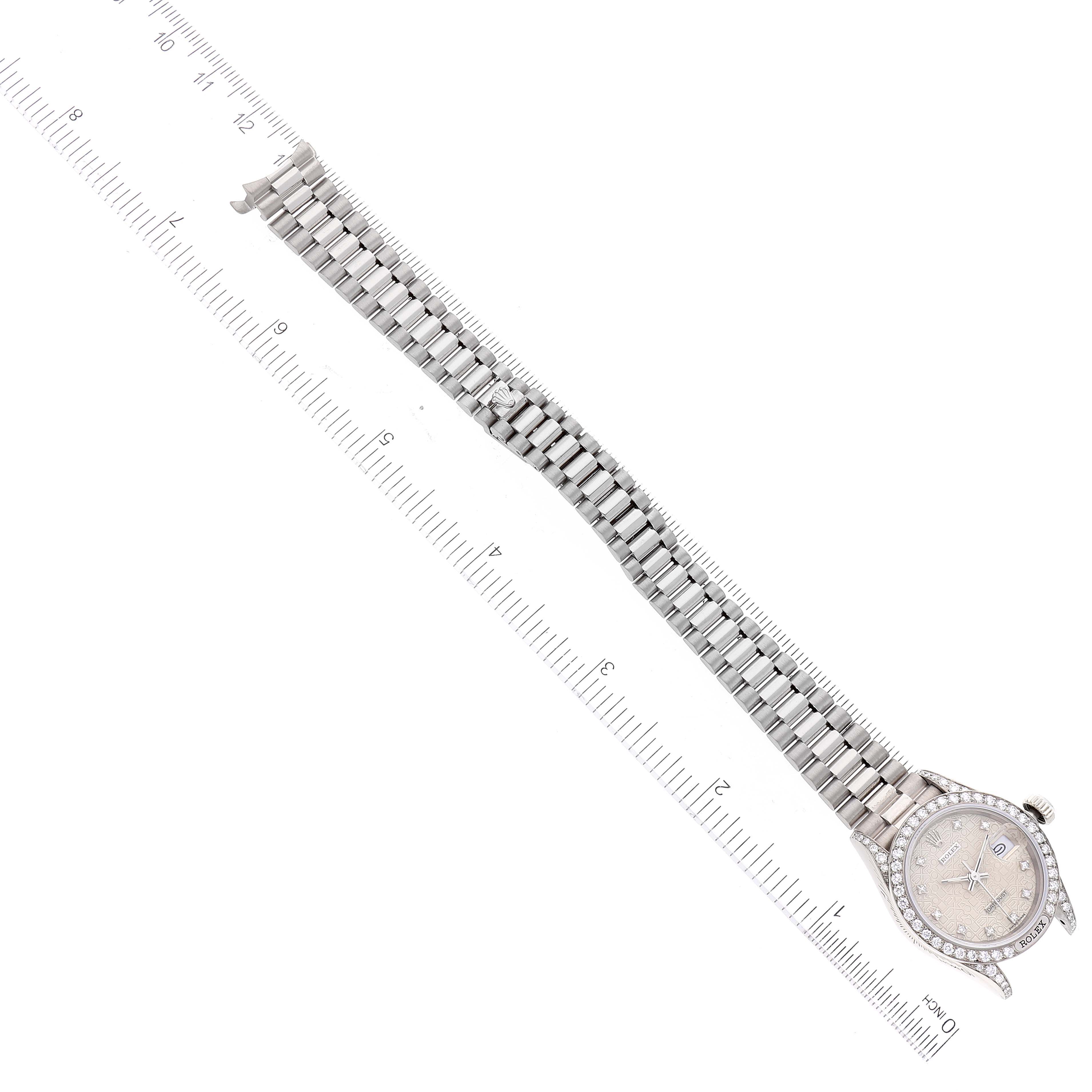 The Rolex President 69159 Women's White Gold Silver Dial 69159 Women's White Gold Silver Dial model watch is shown from the top view, displaying its face, bezel, bracelet, and measuring scale.