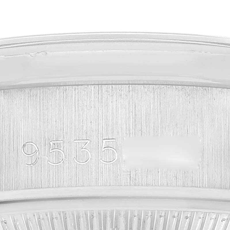This image shows a close-up of the serial number engraving on the side of a Rolex President 69159 Women's White Gold Silver Dial 69159 Women's White Gold Silver Dial model watch.